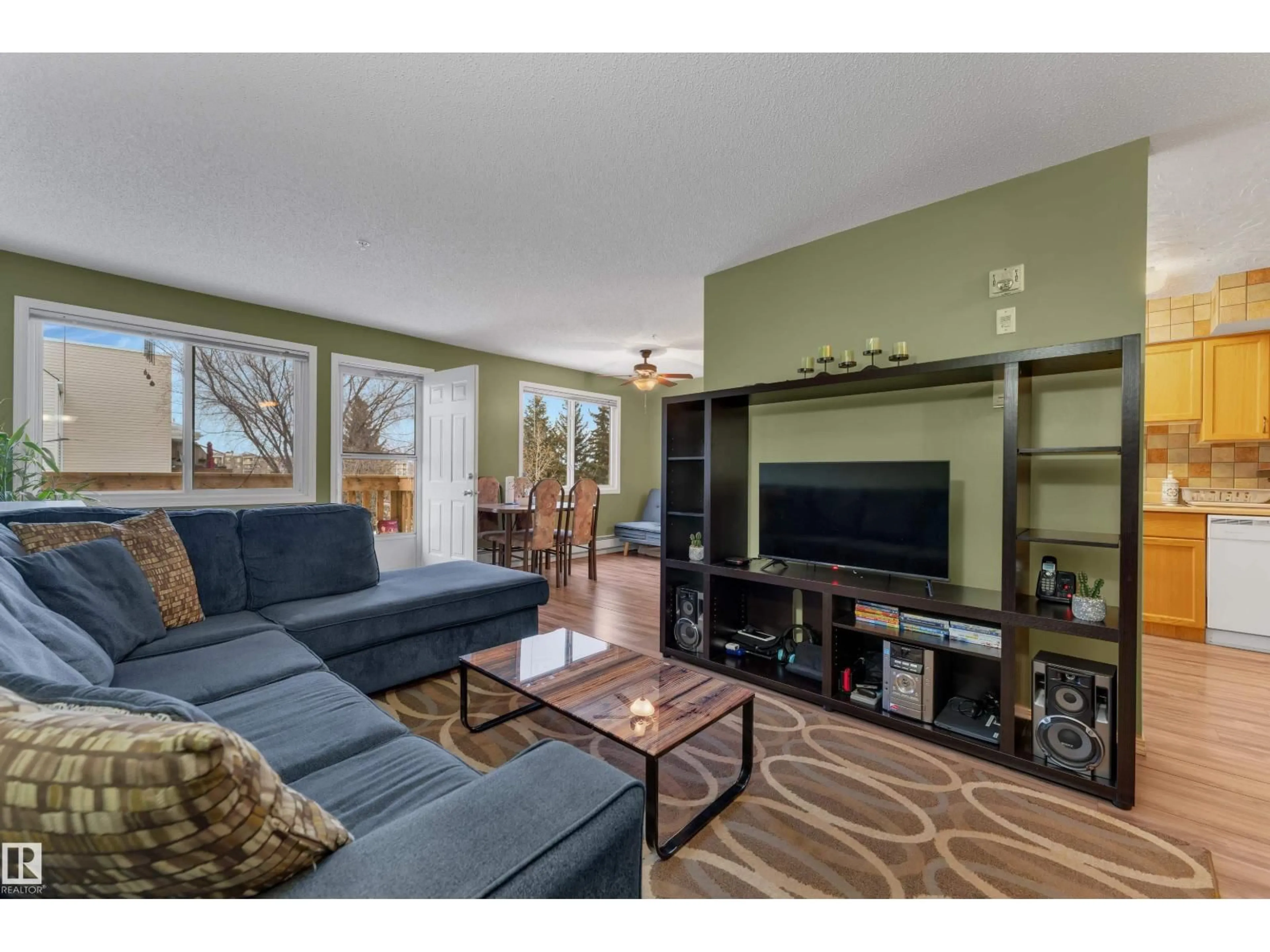 Living room with furniture, wood/laminate floor for 105 - 207 MCKENNEY AVE, St. Albert Alberta T8N2Y2