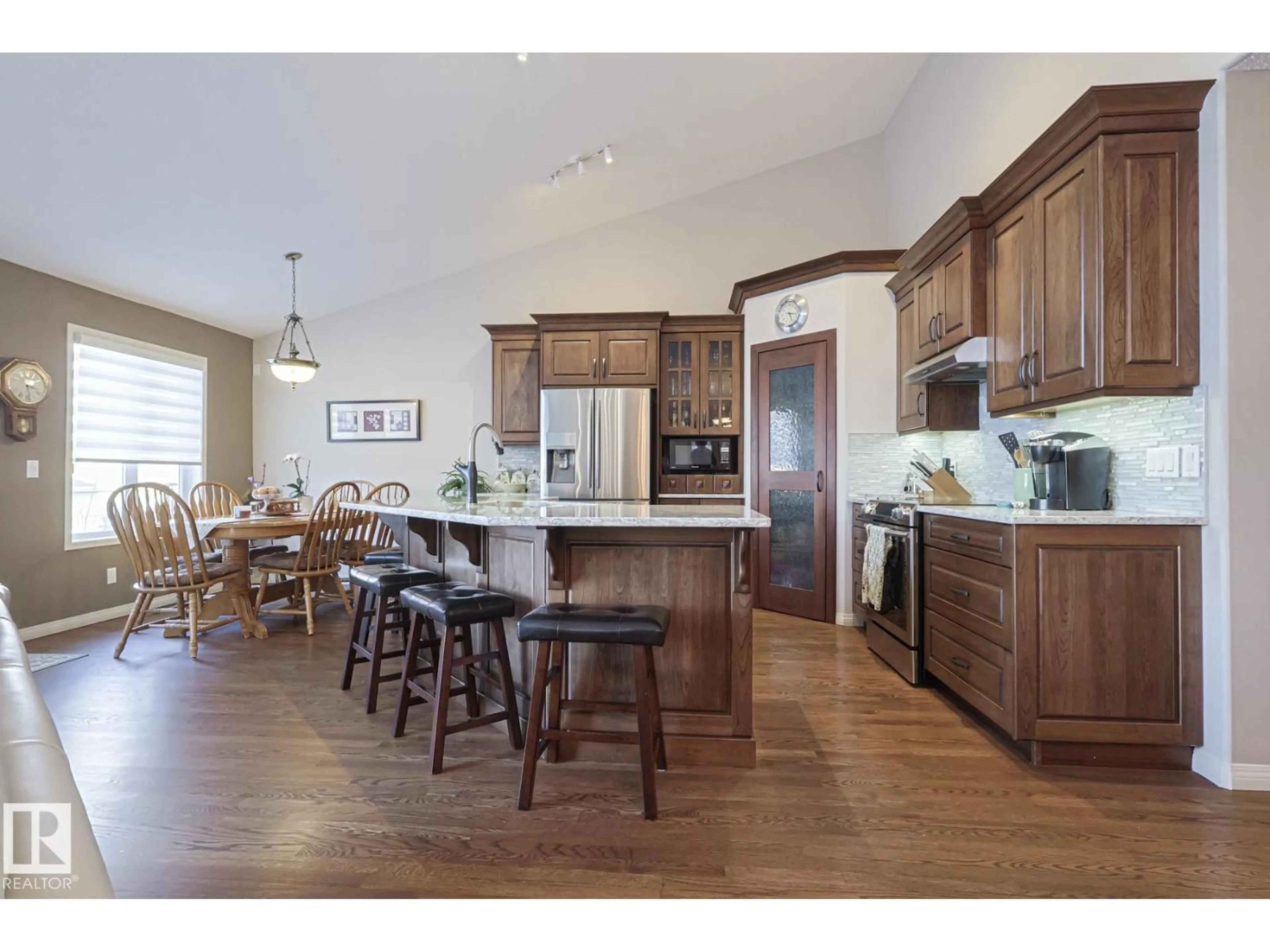 Open concept kitchen, wood/laminate floor for 32 600 REGENCY DR, Sherwood Park Alberta T8A6L6