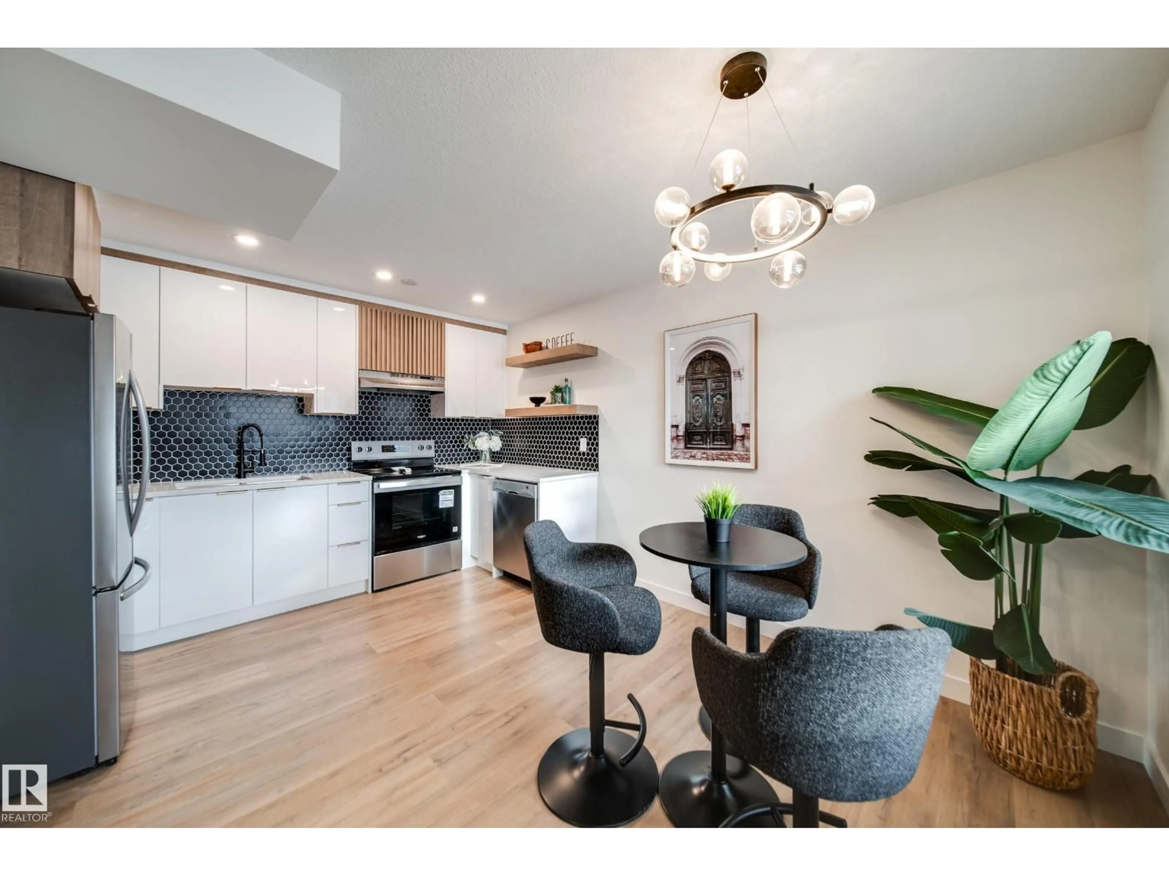 Open concept kitchen, wood/laminate floor for 17751 95 ST, Edmonton Alberta T5Z2E3