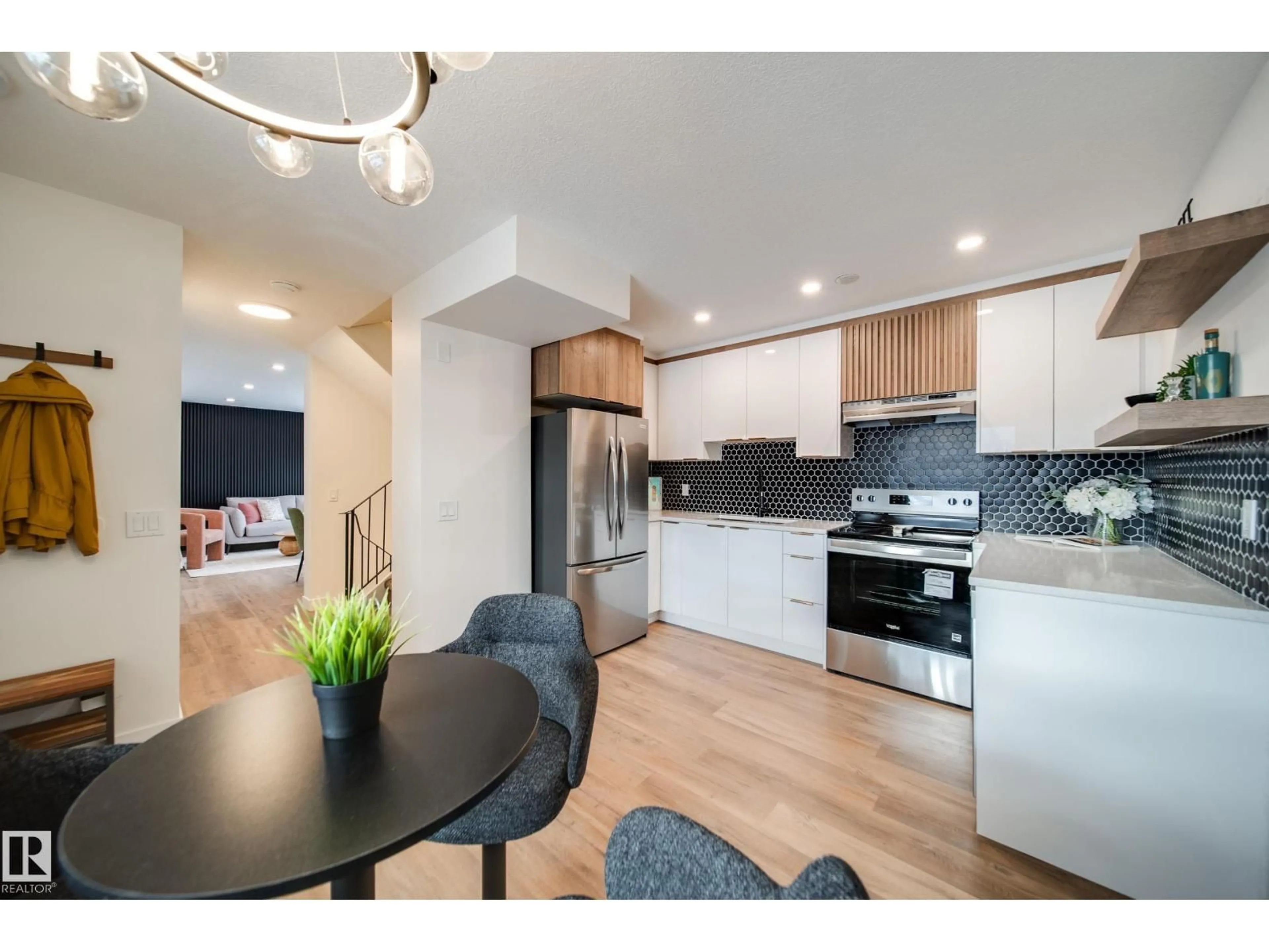 Open concept kitchen, wood/laminate floor for 17751 95 ST, Edmonton Alberta T5Z2E3