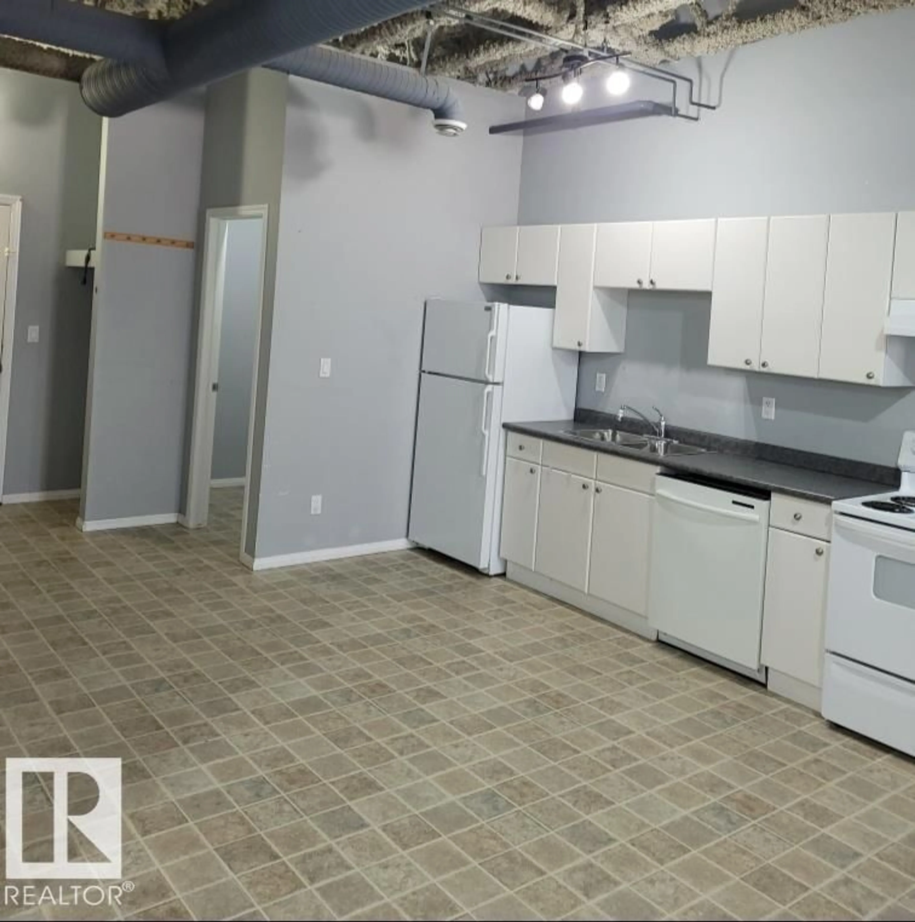 Kitchen with laundary machines, unknown for #102 - 9817 103 ST, Fort Saskatchewan Alberta T8L2C7