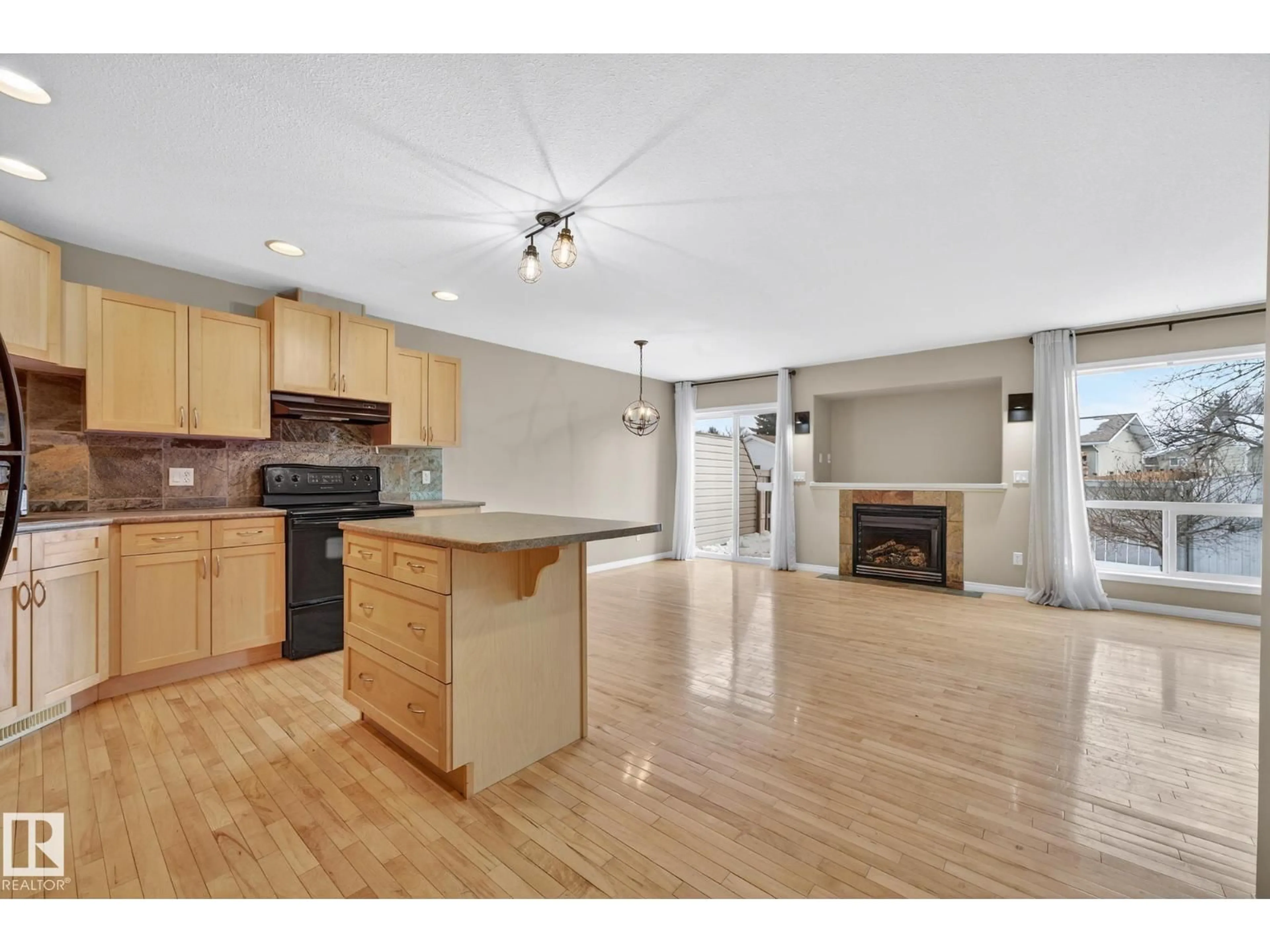 Open concept kitchen, wood/laminate floor for 9503 99 ST, Morinville Alberta T8R1T7