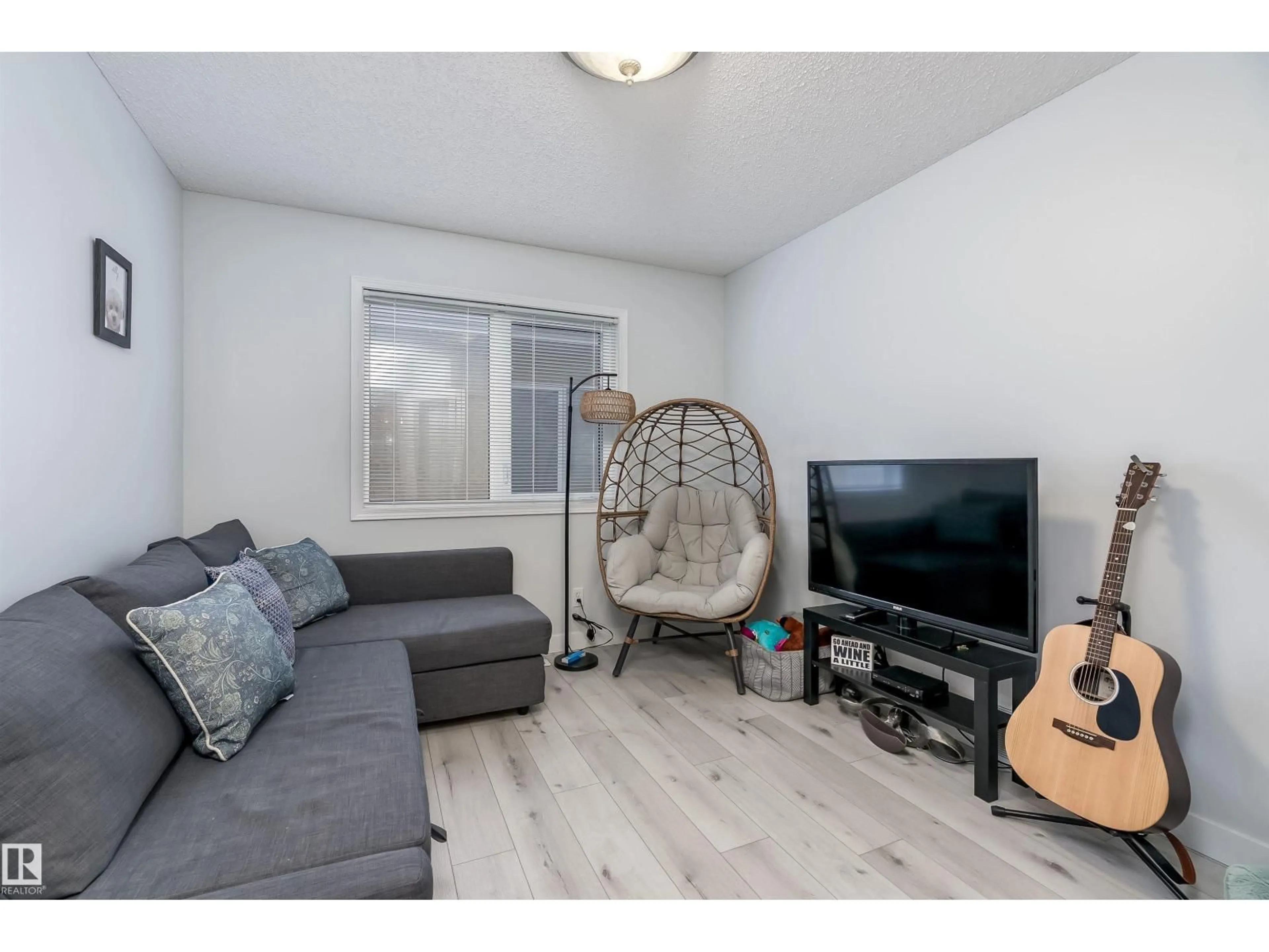 Living room with furniture, wood/laminate floor for 66 BRIDGEPORT WD, Leduc Alberta T9E8B4