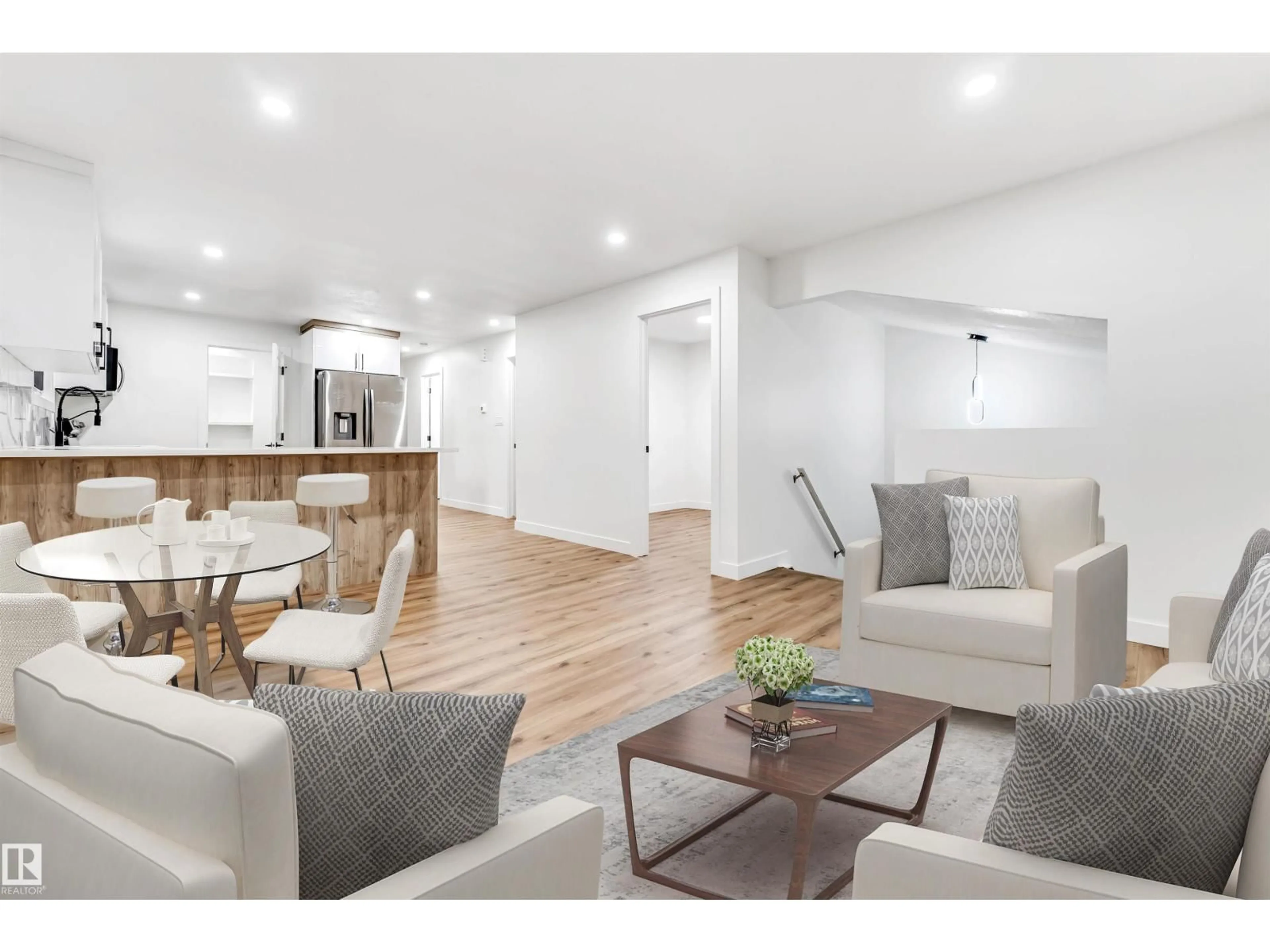 Living room with furniture, wood/laminate floor for 4616 32 AV, Edmonton Alberta T6L5J4