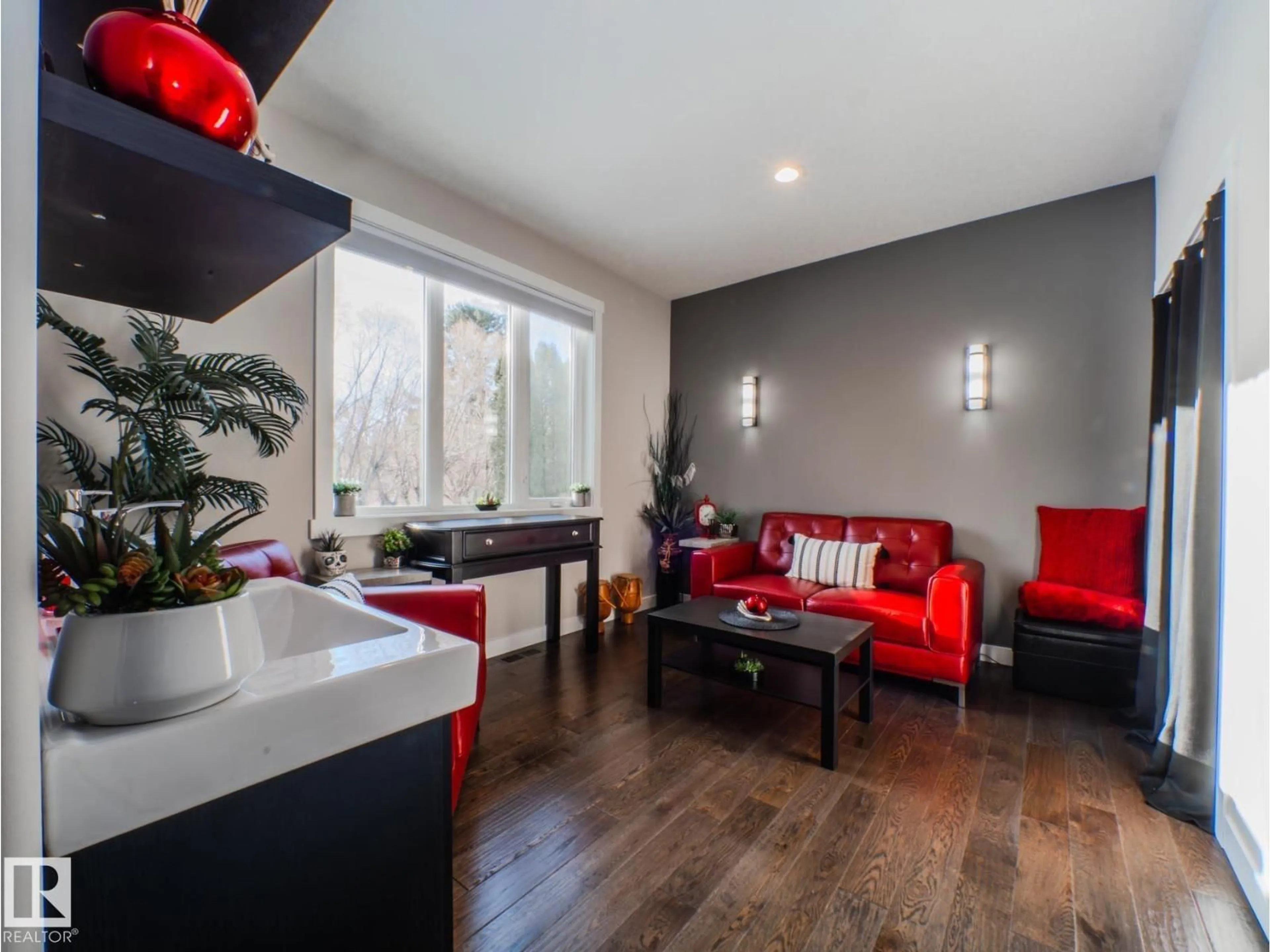 Living room with furniture, wood/laminate floor for 231 75 ST, Edmonton Alberta T6X1A3