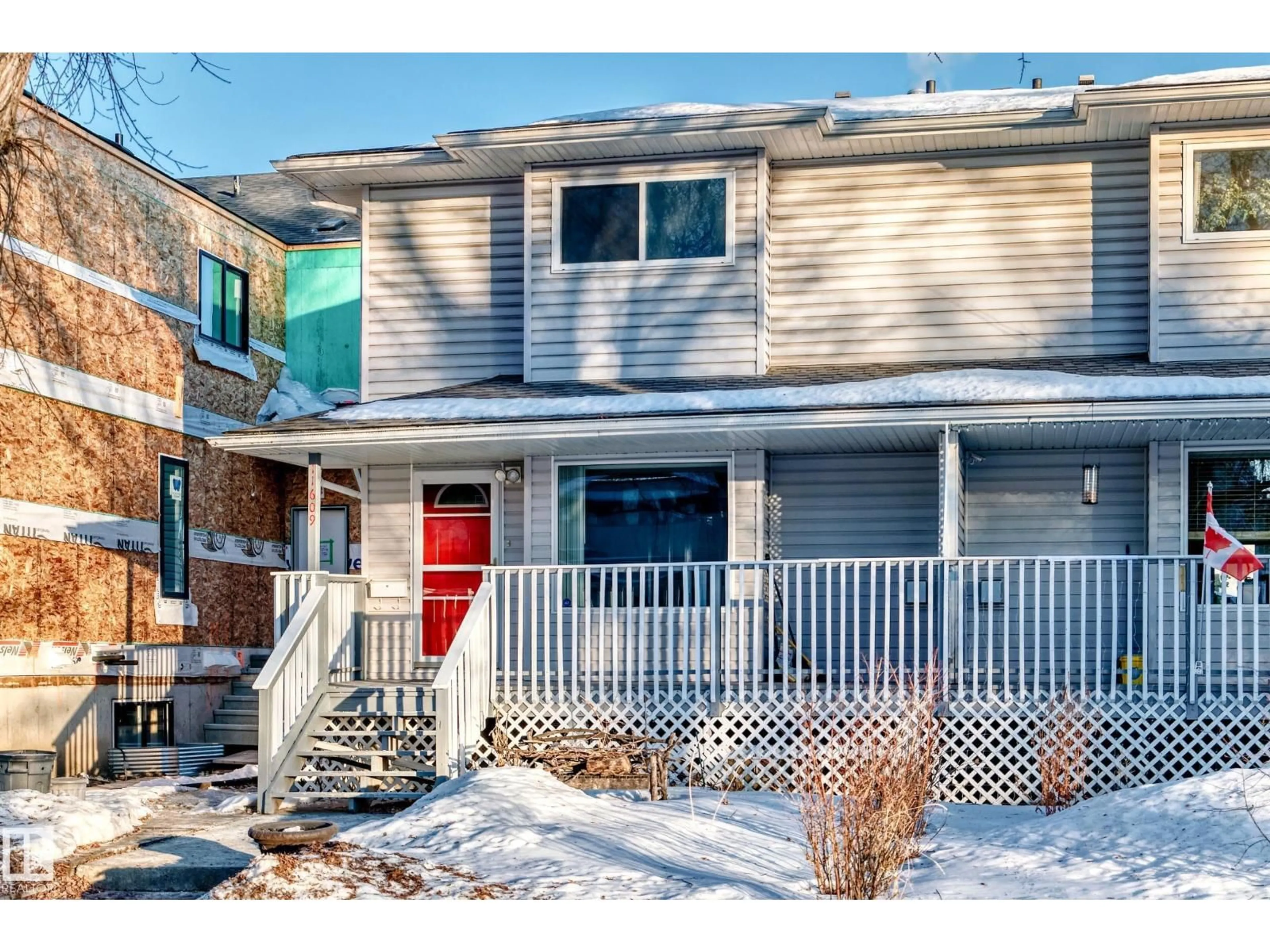 Home with vinyl exterior material, street for 11609 125 ST, Edmonton Alberta T5M0N5