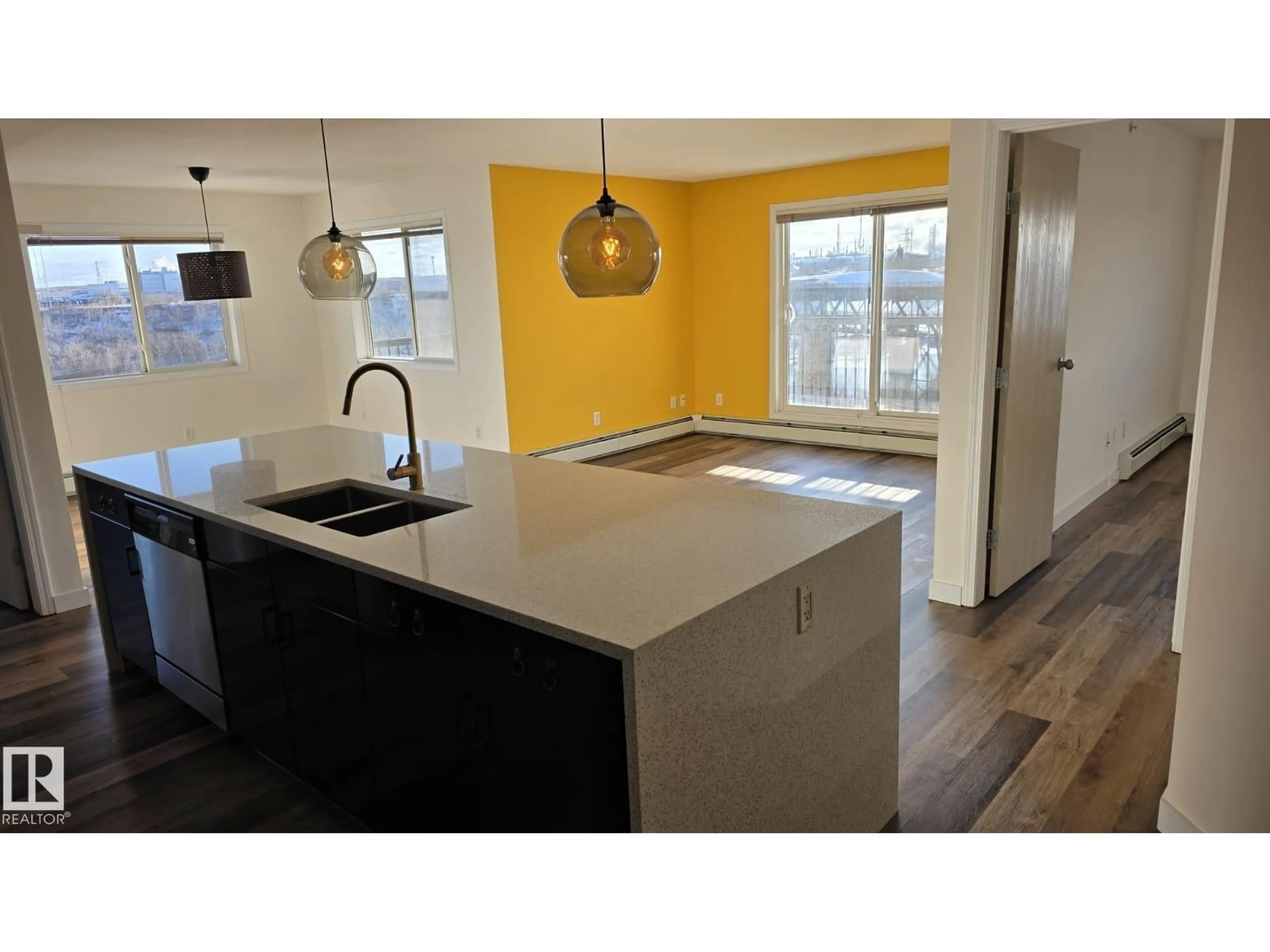 Open concept kitchen, wood/laminate floor for 1188 - 415 HYNDMAN RD, Edmonton Alberta T5A0E9