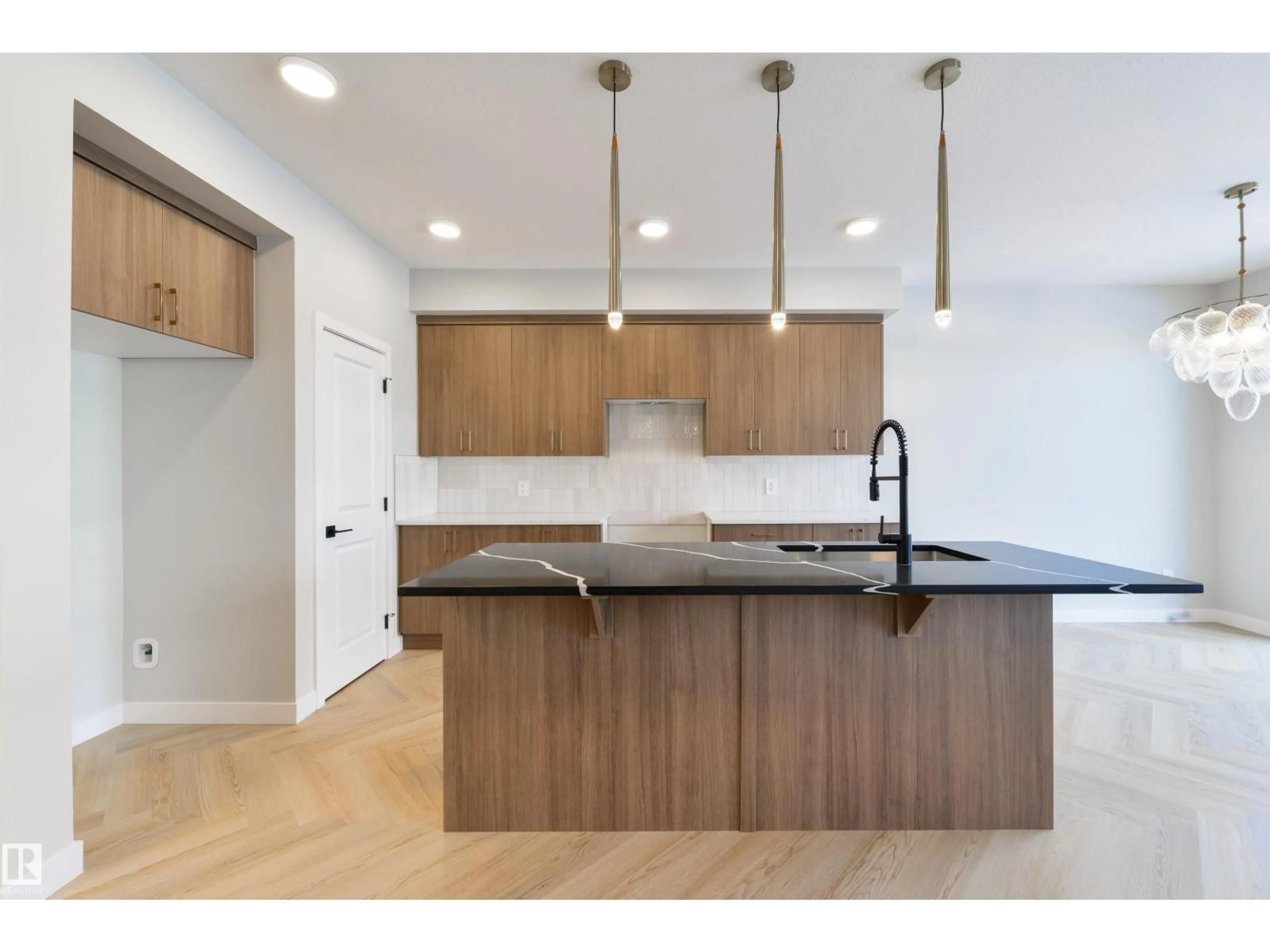 Open concept kitchen, wood/laminate floor for 13 COBBLESTONE GA, Spruce Grove Alberta T7X4E4