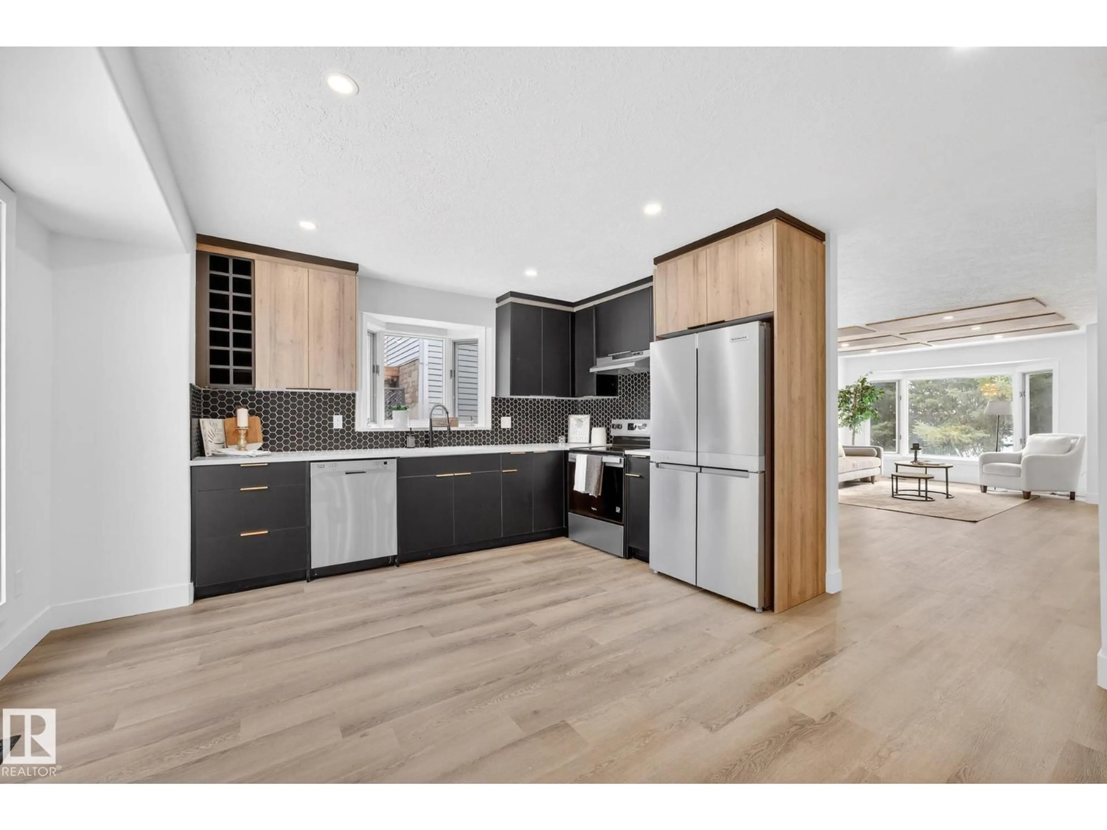 Open concept kitchen, wood/laminate floor for 7924 157 AV, Edmonton Alberta T5Z2T4
