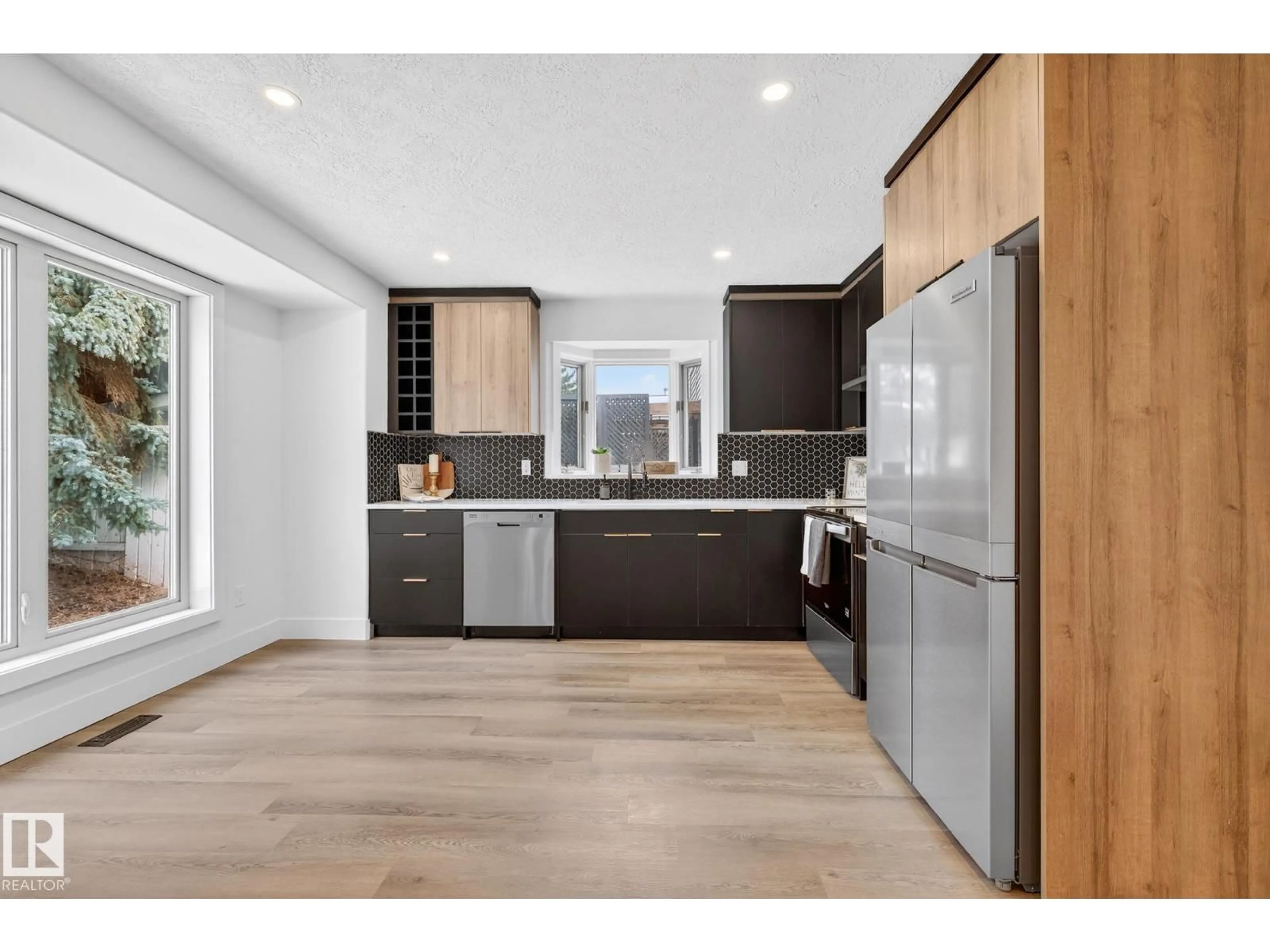 Open concept kitchen, wood/laminate floor for 7924 157 AV, Edmonton Alberta T5Z2T4