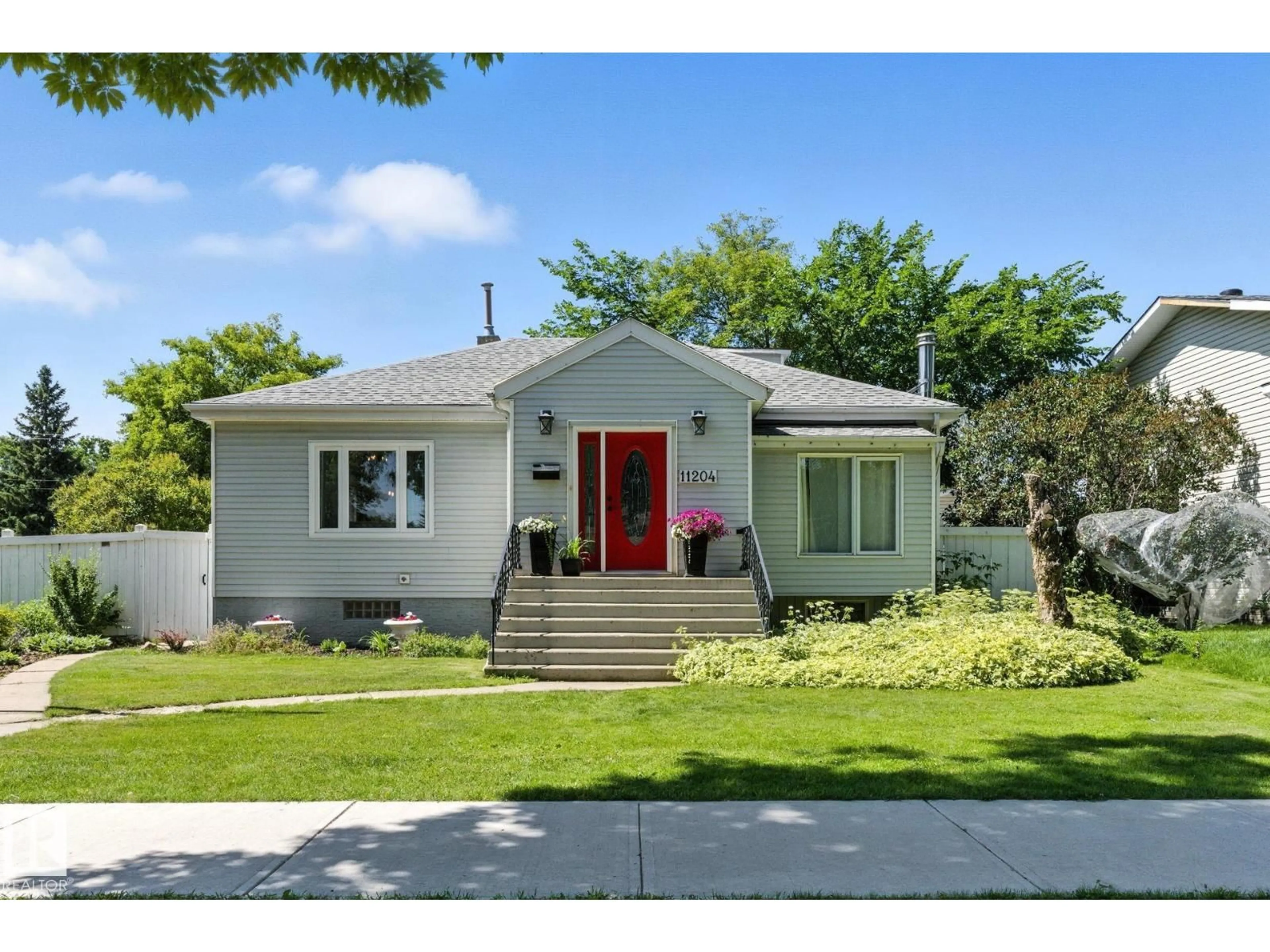 Home with vinyl exterior material, street for 11204 61 ST, Edmonton Alberta T5W4A5