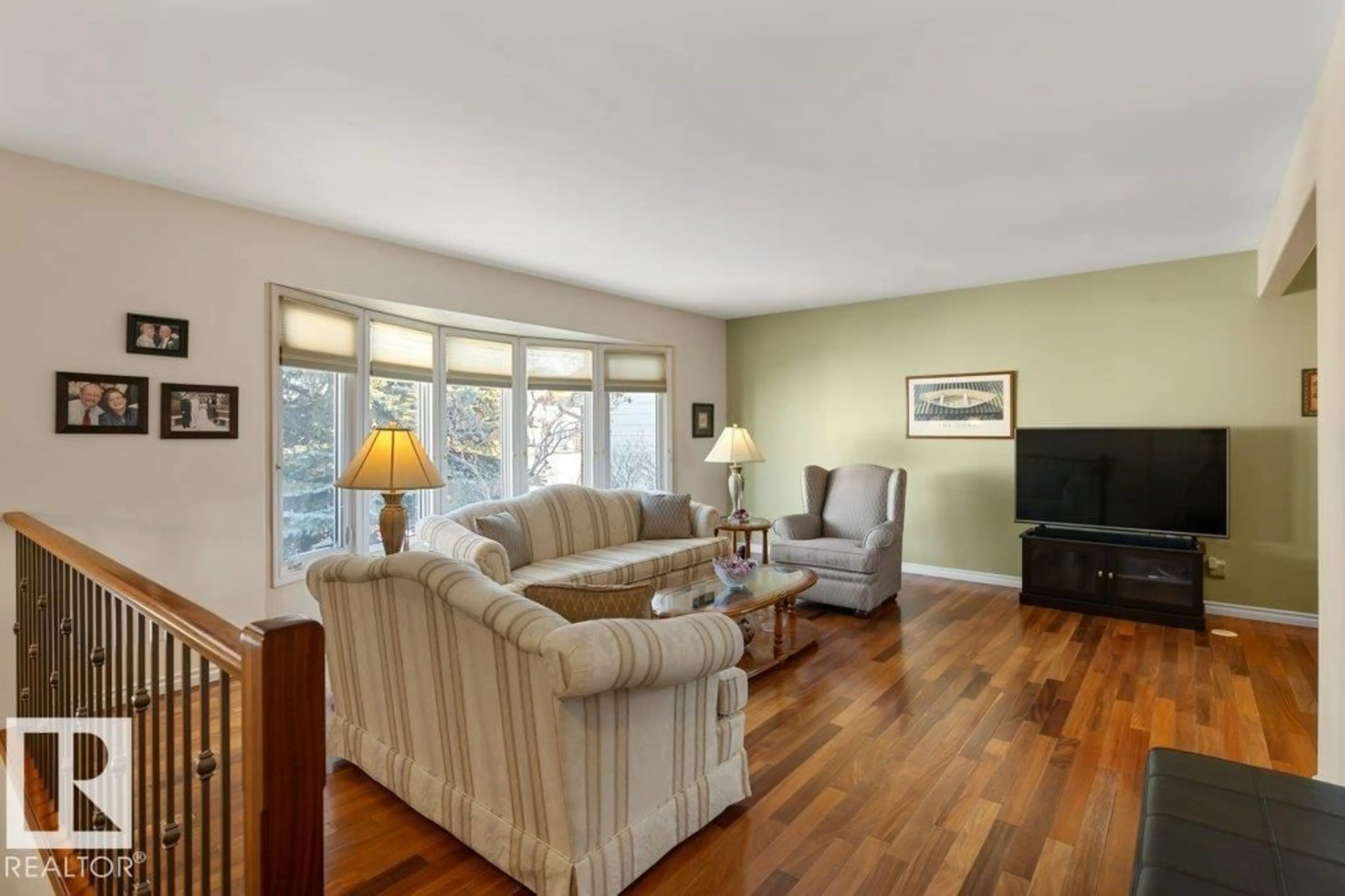 Living room with furniture, wood/laminate floor for 16132 100 ST, Edmonton Alberta T5X4R7