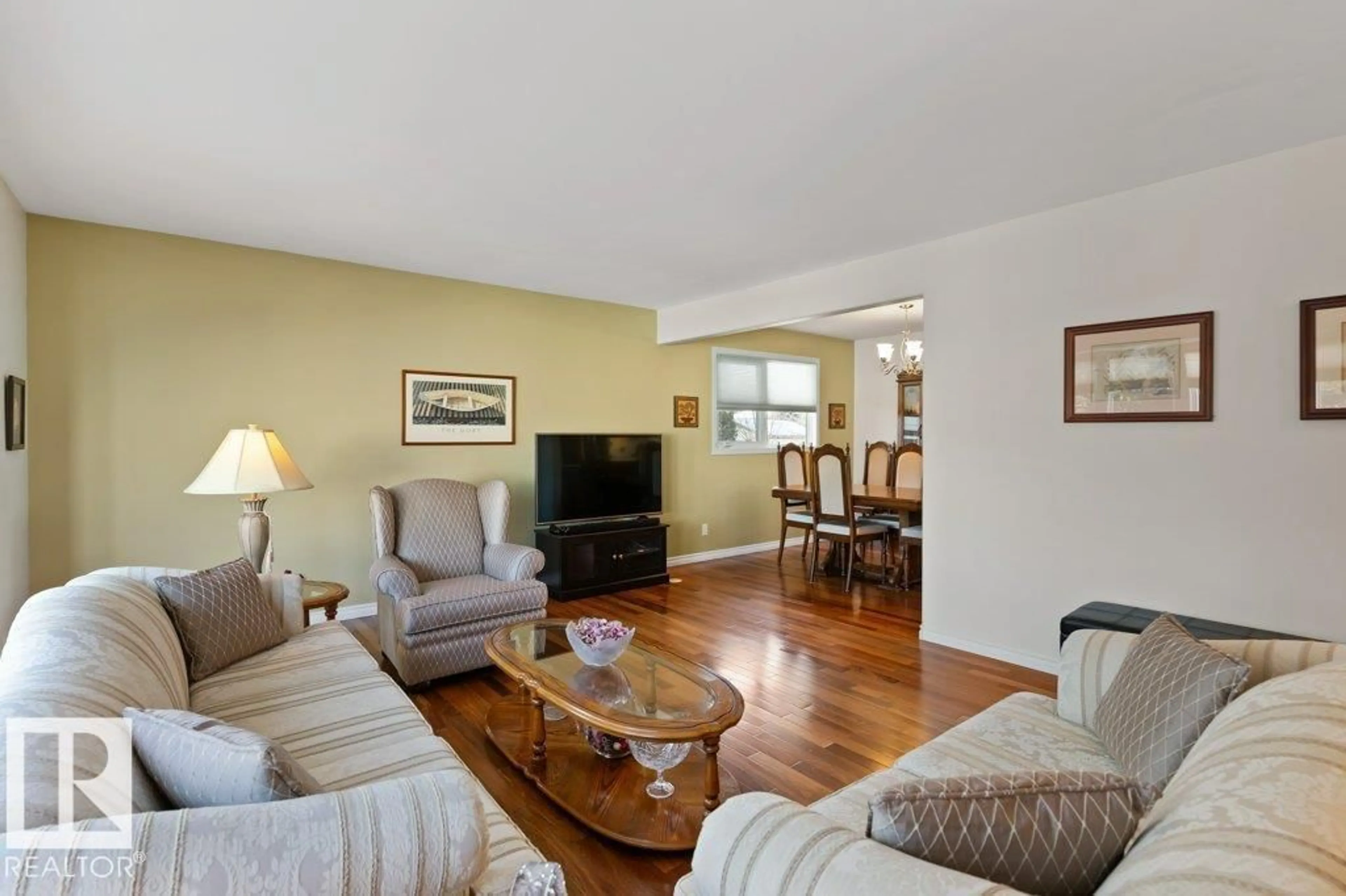 Living room with furniture, wood/laminate floor for 16132 100 ST, Edmonton Alberta T5X4R7