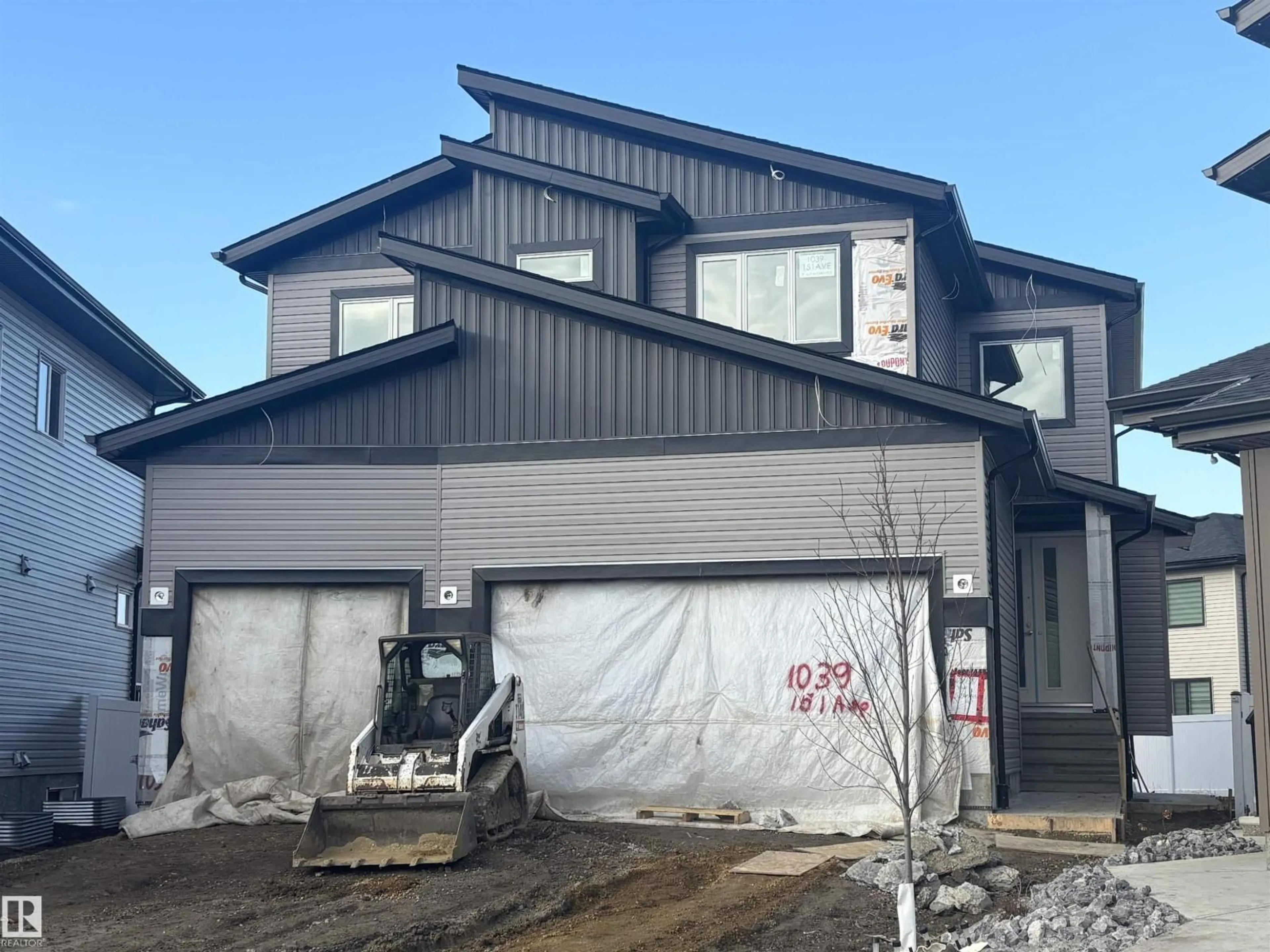 Home with vinyl exterior material, street for NW - 1039 151 AVE, Edmonton Alberta T5Y4C8