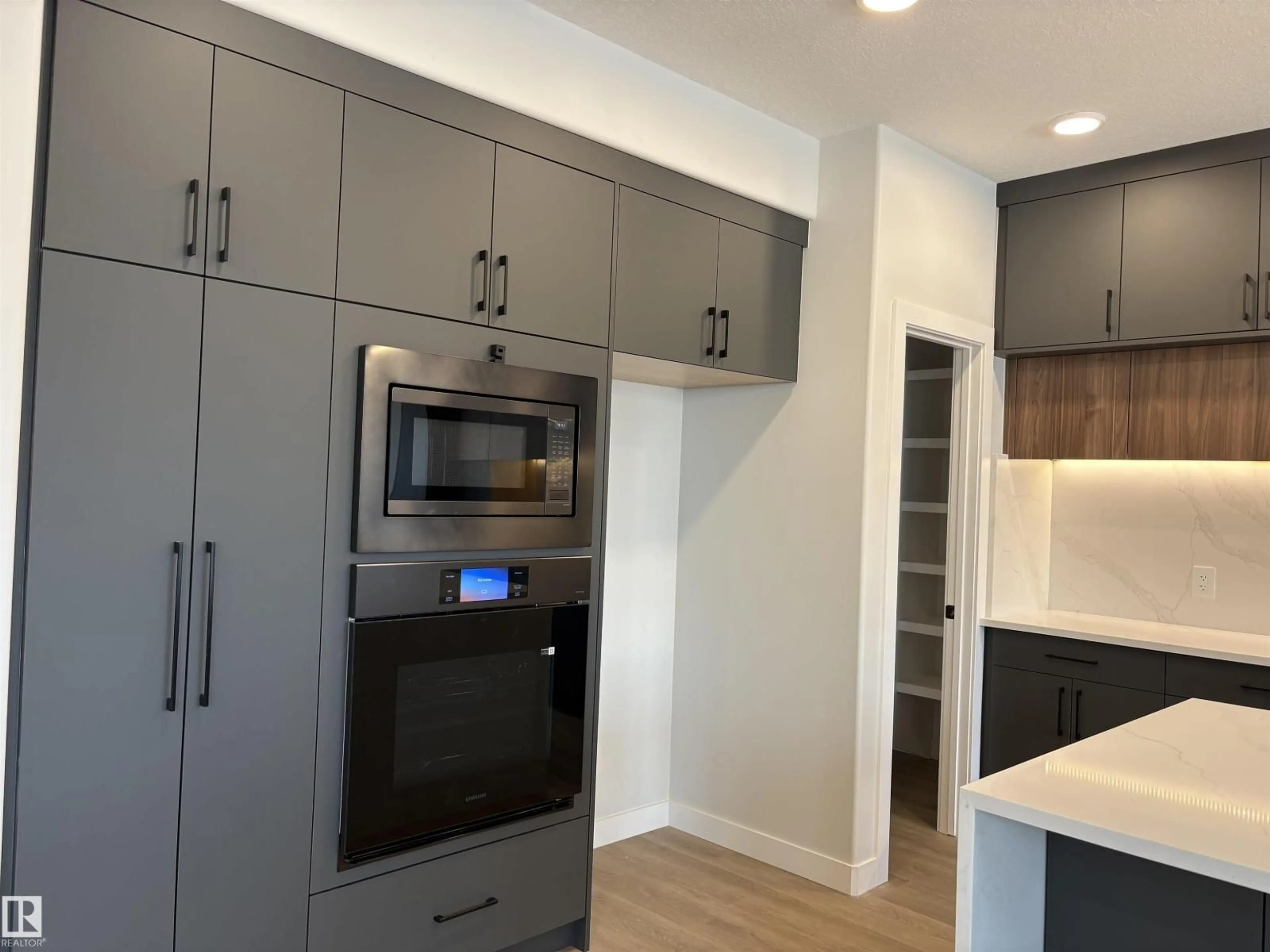 Open concept kitchen, wood/laminate floor for NW - 1039 151 AVE, Edmonton Alberta T5Y4C8