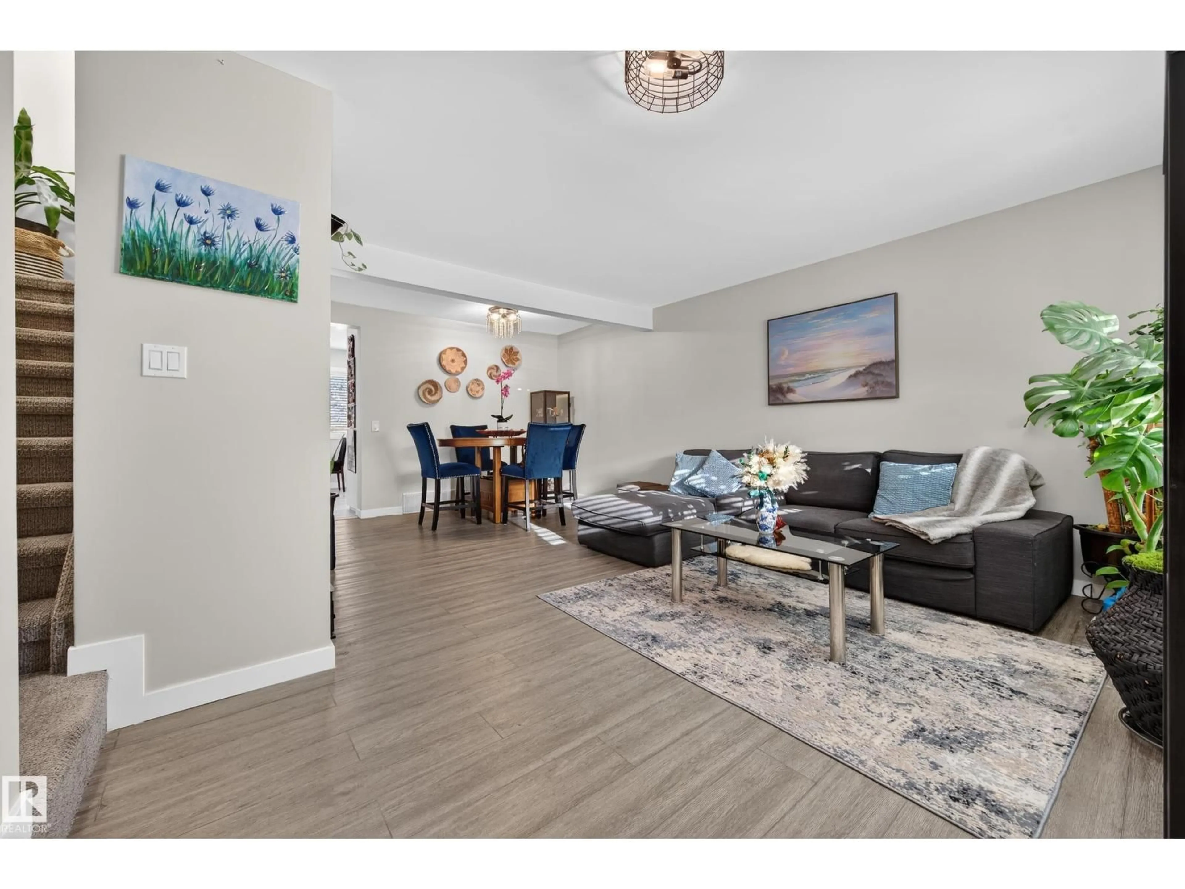 Living room with furniture, wood/laminate floor for 4755 35 AV, Edmonton Alberta T6L3P8