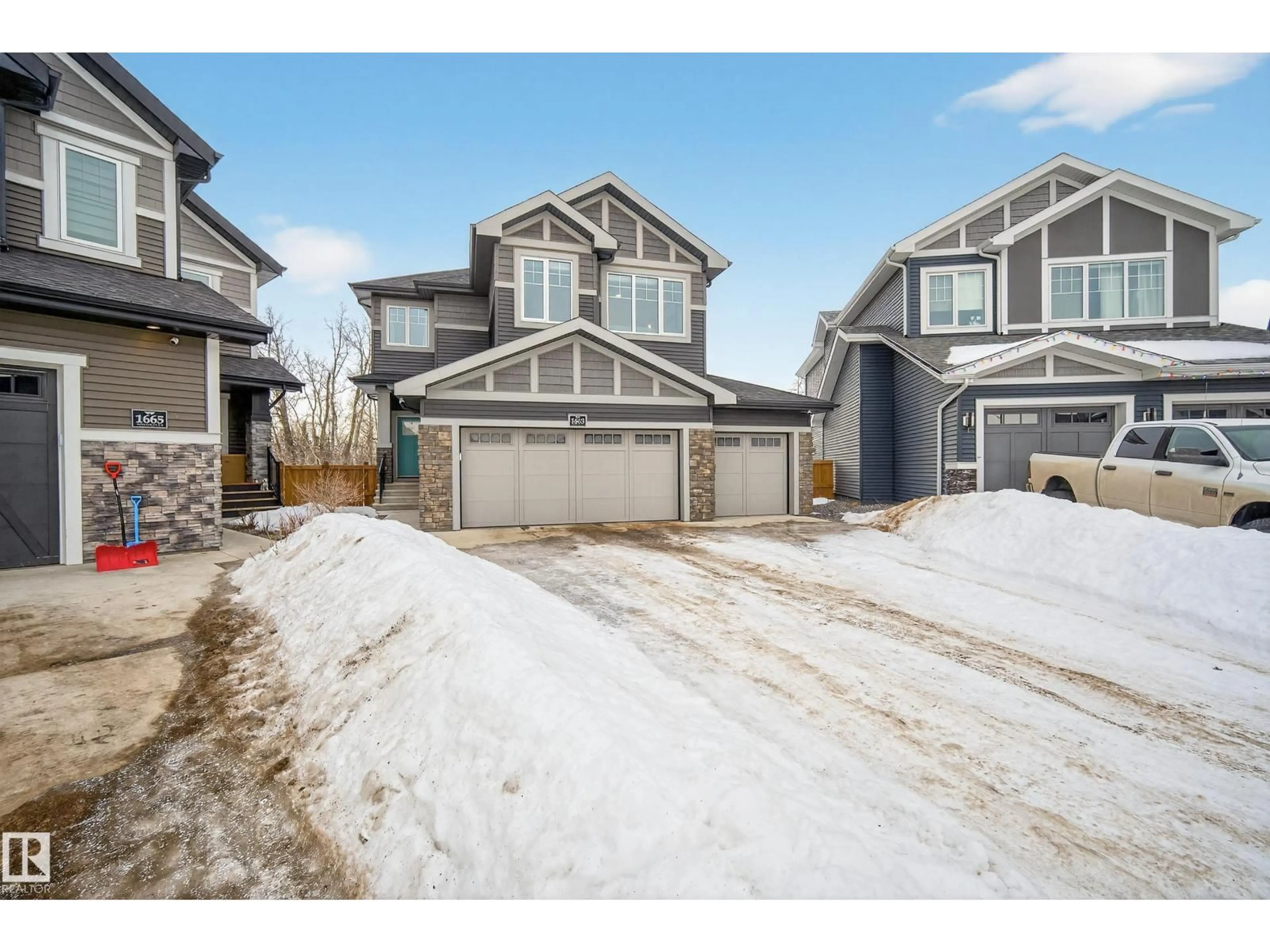 A pic from outside/outdoor area/front of a property/back of a property/a pic from drone, street for 1663 ENRIGHT WY, Edmonton Alberta T6M0Z2