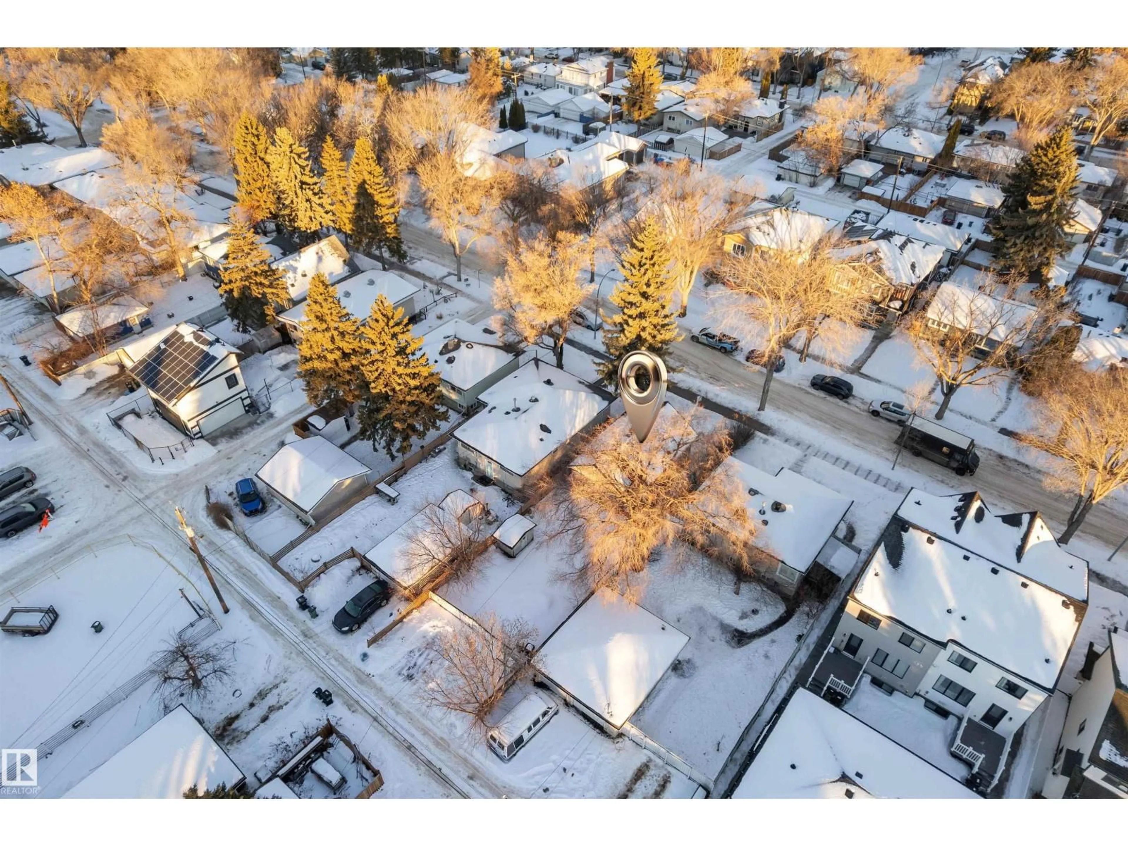 A pic from outside/outdoor area/front of a property/back of a property/a pic from drone, street for 10657 64 AV, Edmonton Alberta T6H1T1
