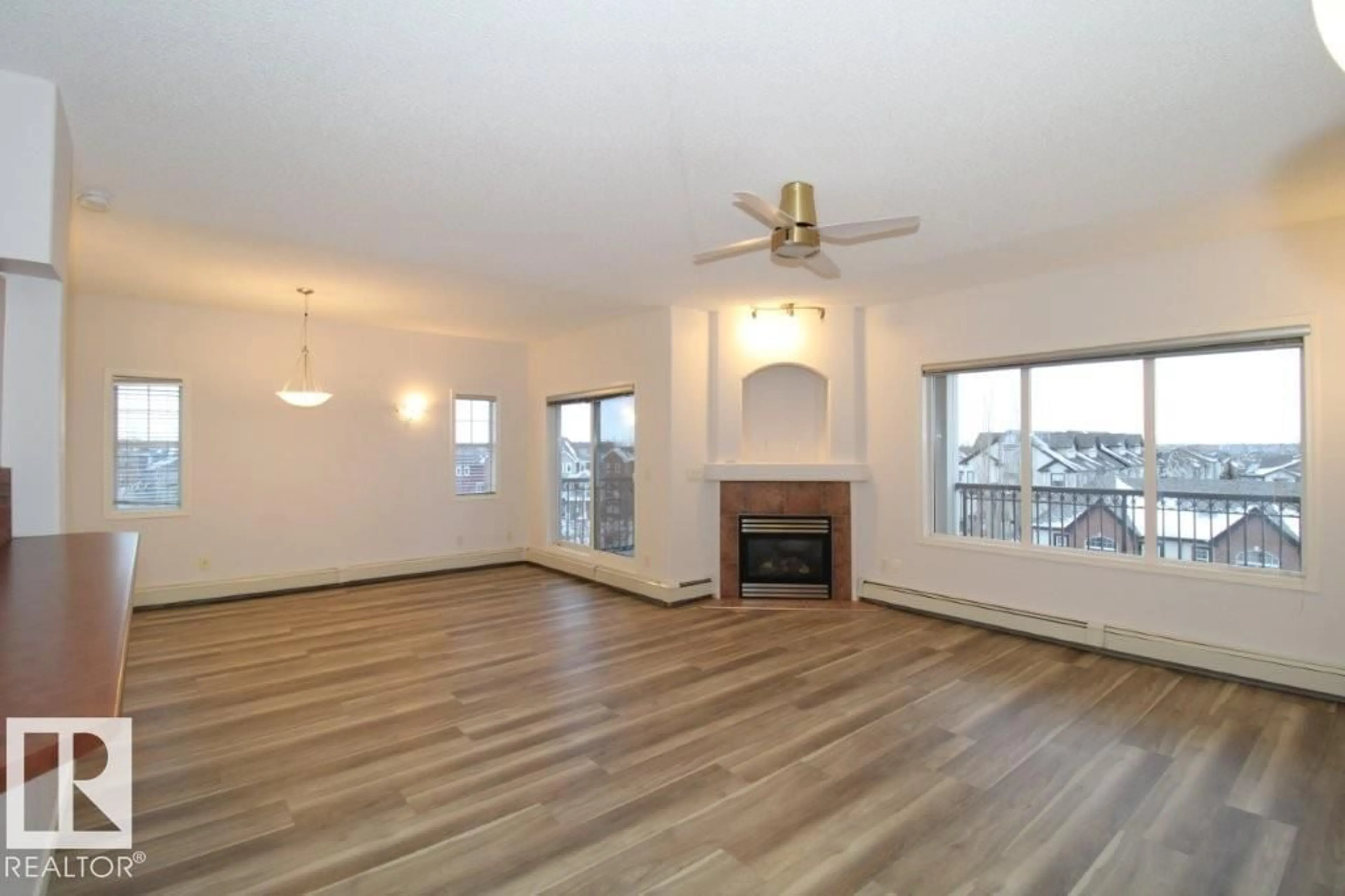 Living room with furniture, wood/laminate floor for #414 - 5280 TERWILLEGAR BV, Edmonton Alberta T6R3T9