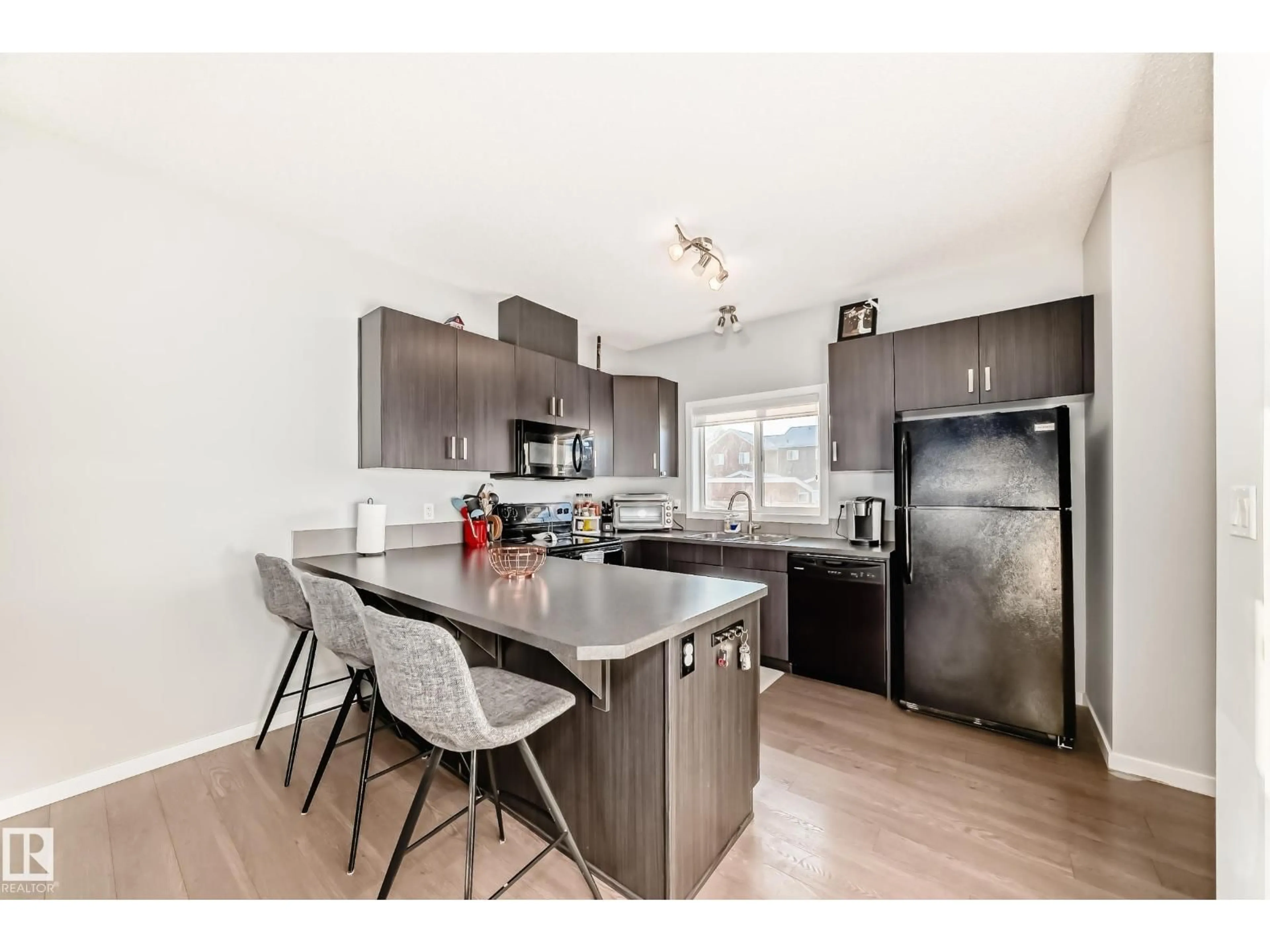 Open concept kitchen, wood/laminate floor for 425 SIMPKINS LI, Leduc Alberta T9E1B8