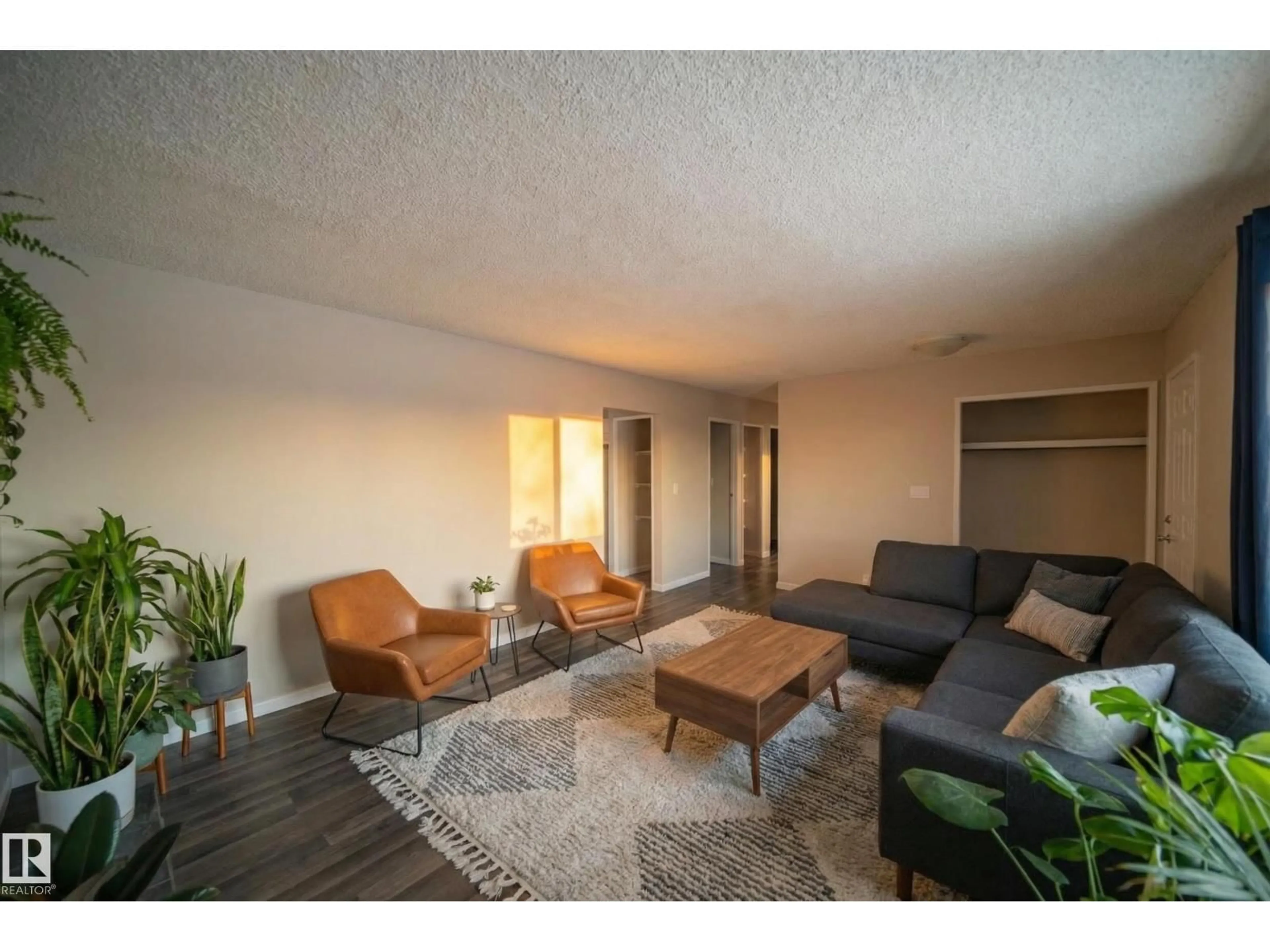 Living room with furniture, wood/laminate floor for 2311 146 AV, Edmonton Alberta T5Y1W4