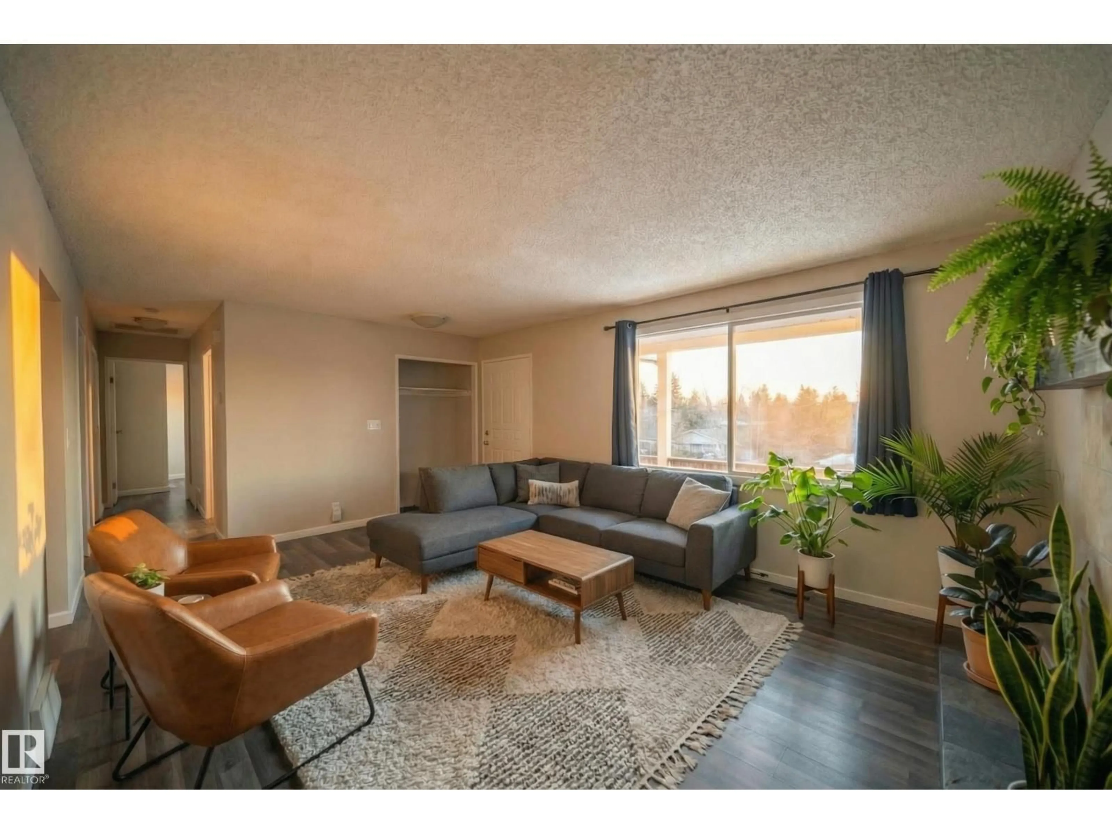 Living room with furniture, wood/laminate floor for 2311 146 AV, Edmonton Alberta T5Y1W4