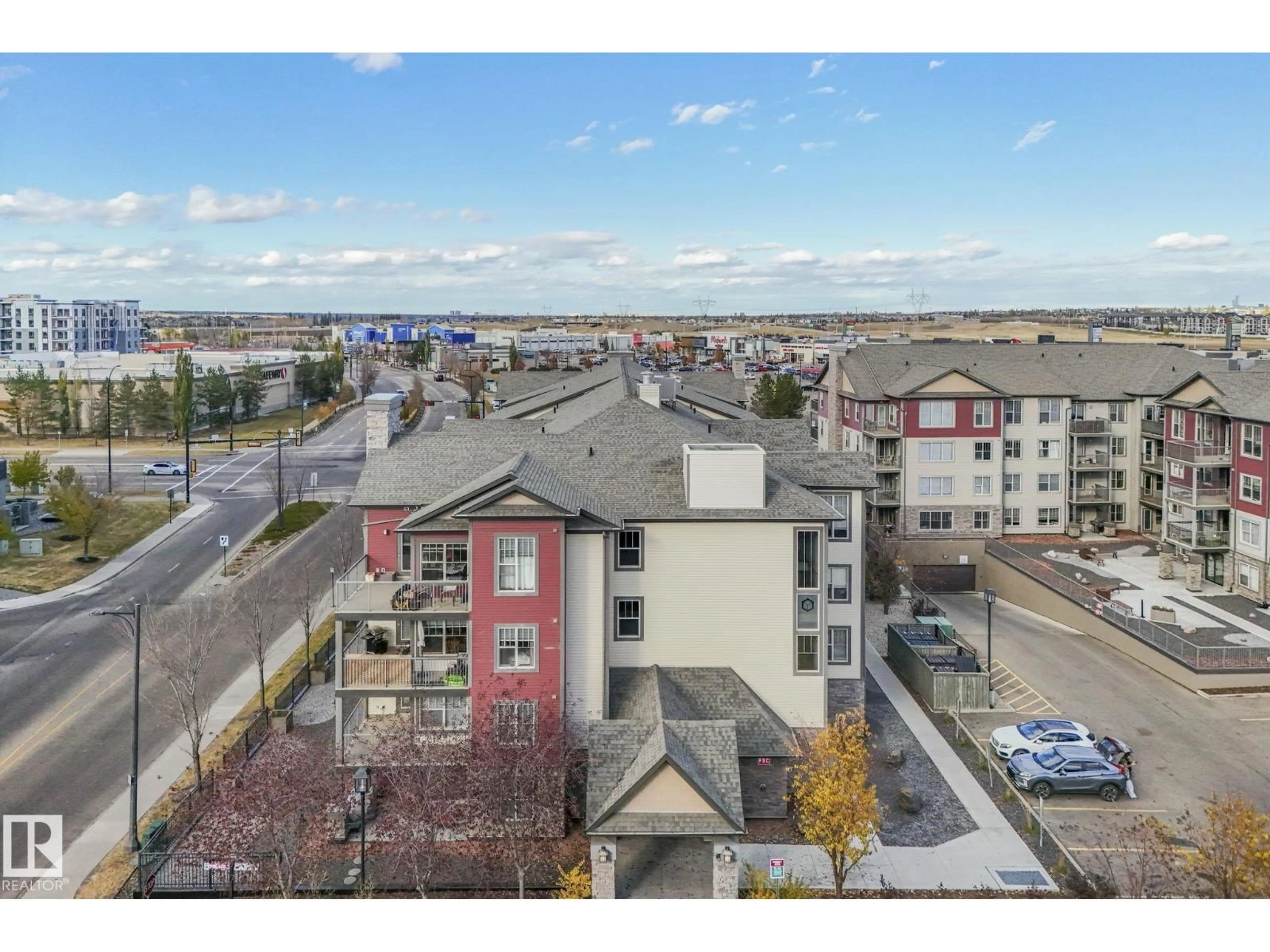 A pic from outside/outdoor area/front of a property/back of a property/a pic from drone, city buildings view from balcony for 103 - 210 AMBLESIDE DR, Edmonton Alberta T6W0J4