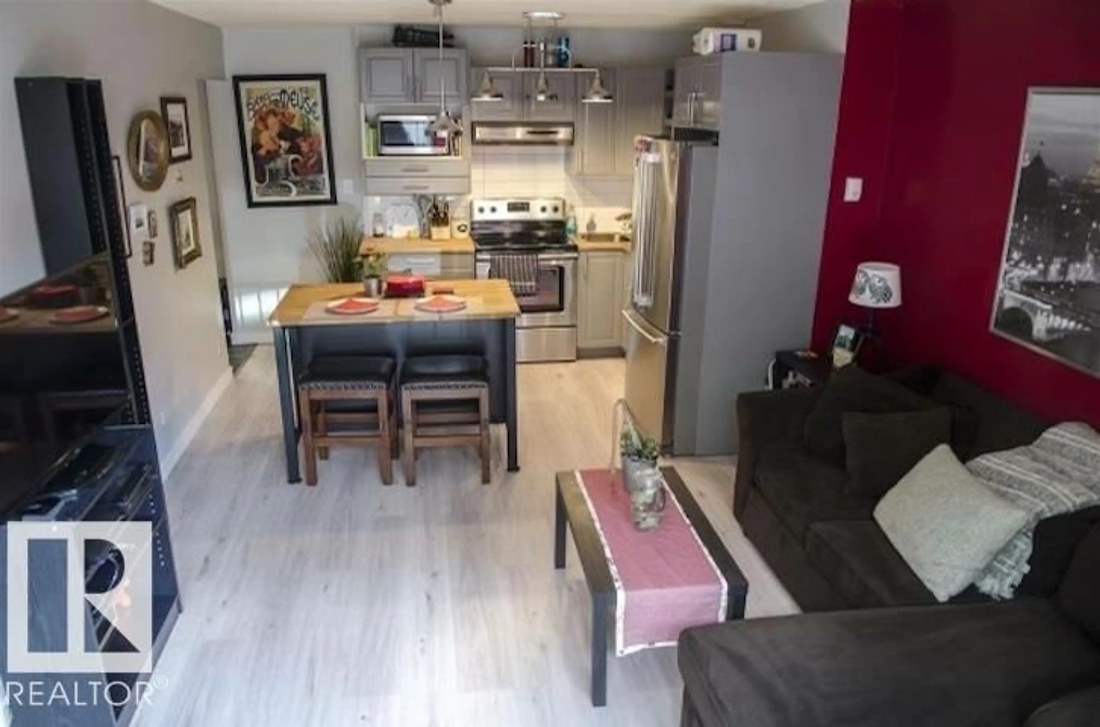 Open concept kitchen, wood/laminate floor for #108 - 11025 JASPER AV, Edmonton Alberta T5K0K7