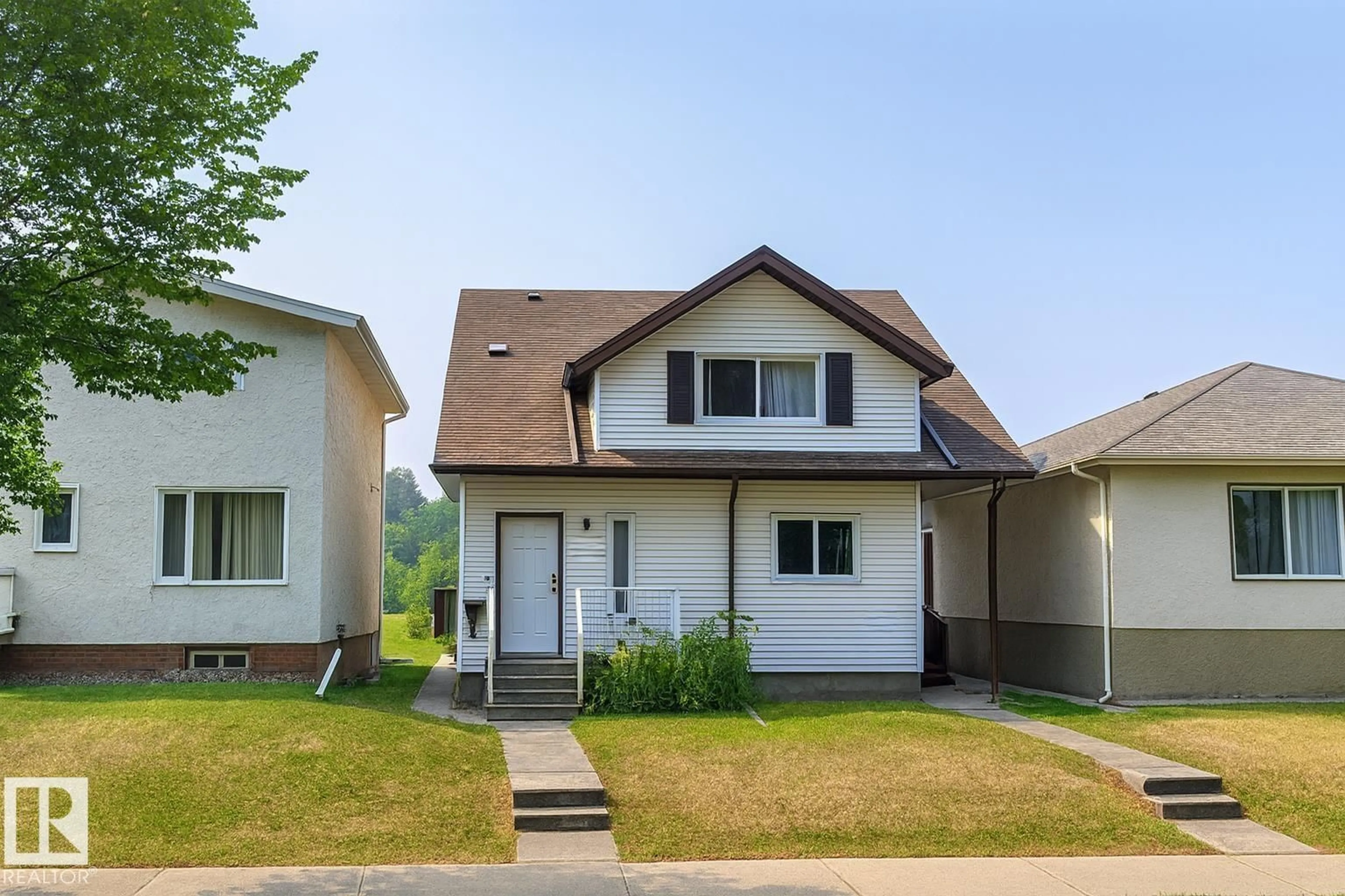 Home with vinyl exterior material, street for 10831 80 AV, Edmonton Alberta T6E1V9