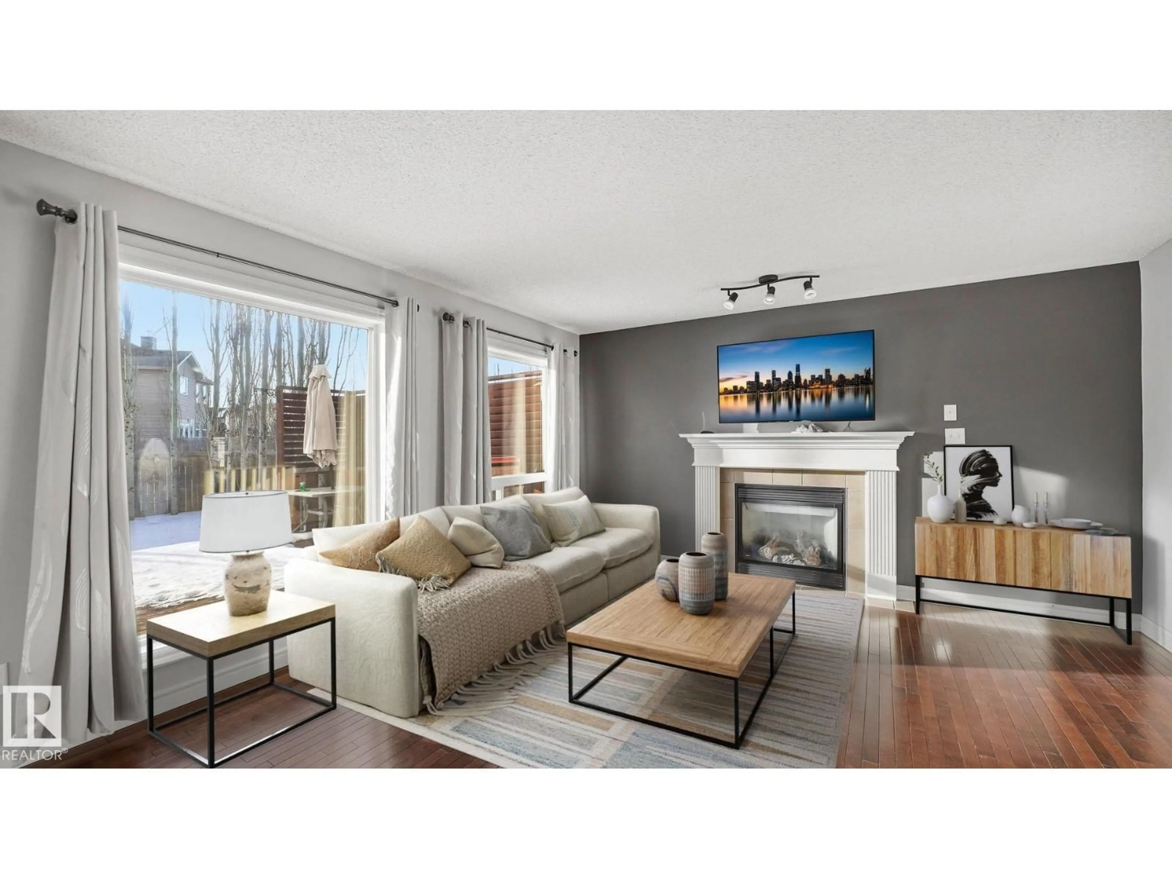 Living room with furniture, wood/laminate floor for 9 HICKORY TR, Spruce Grove Alberta T7X0A6