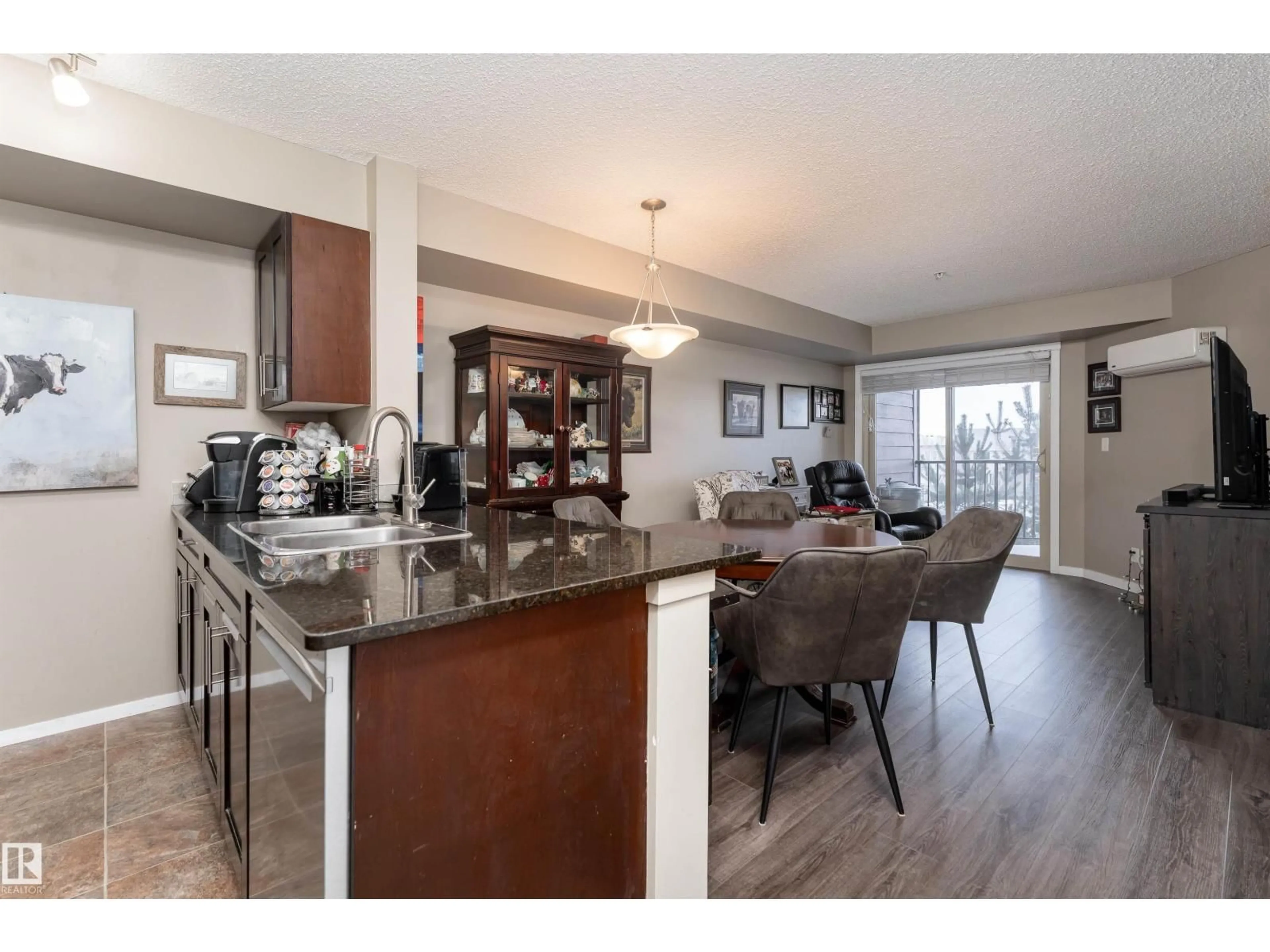 Open concept kitchen, wood/laminate floor for #314 - 5370 CHAPPELLE RD, Edmonton Alberta T6W3L5