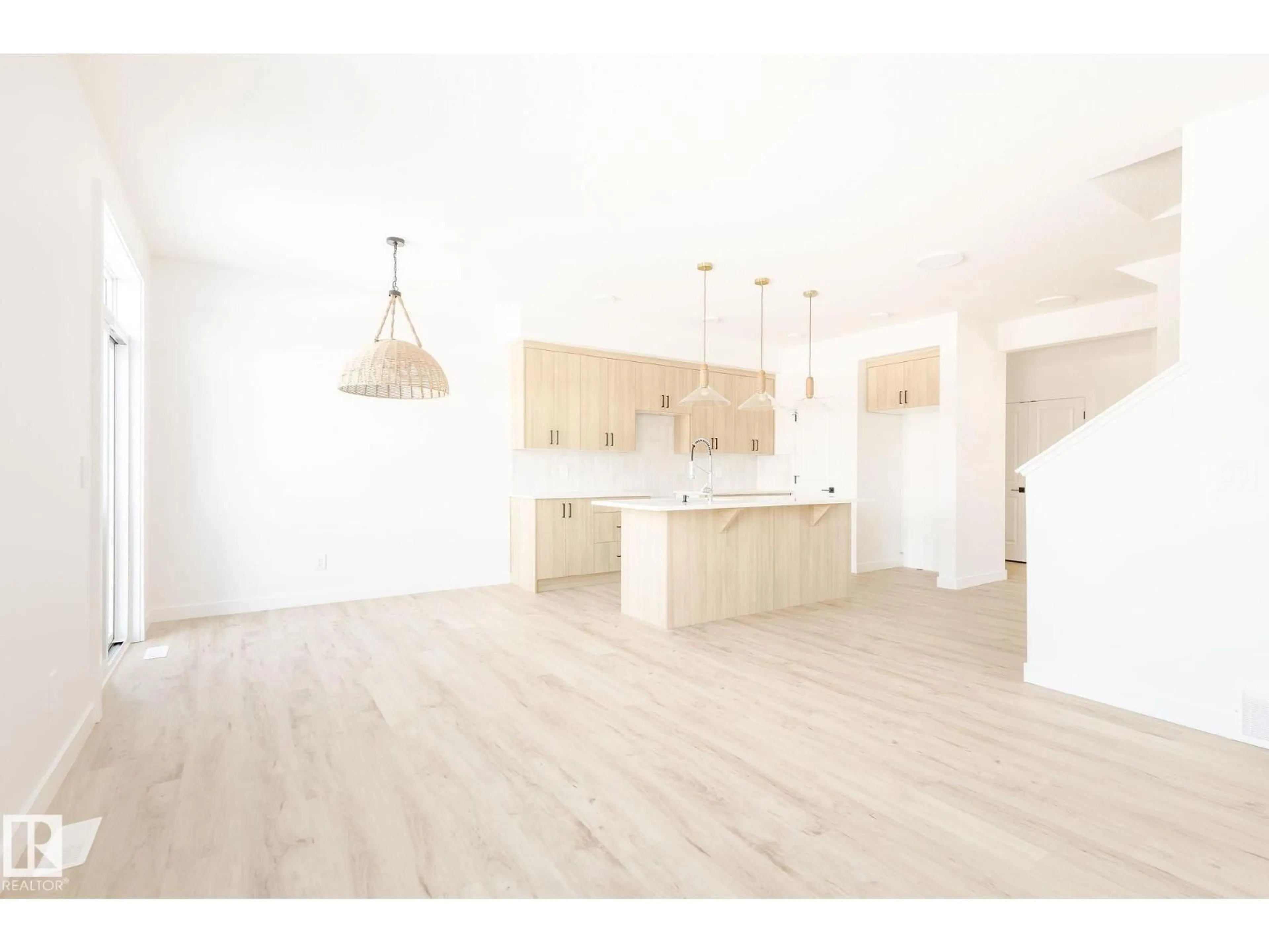 Open concept kitchen, wood/laminate floor for 2636 62 ST, Edmonton Alberta T6X0C1