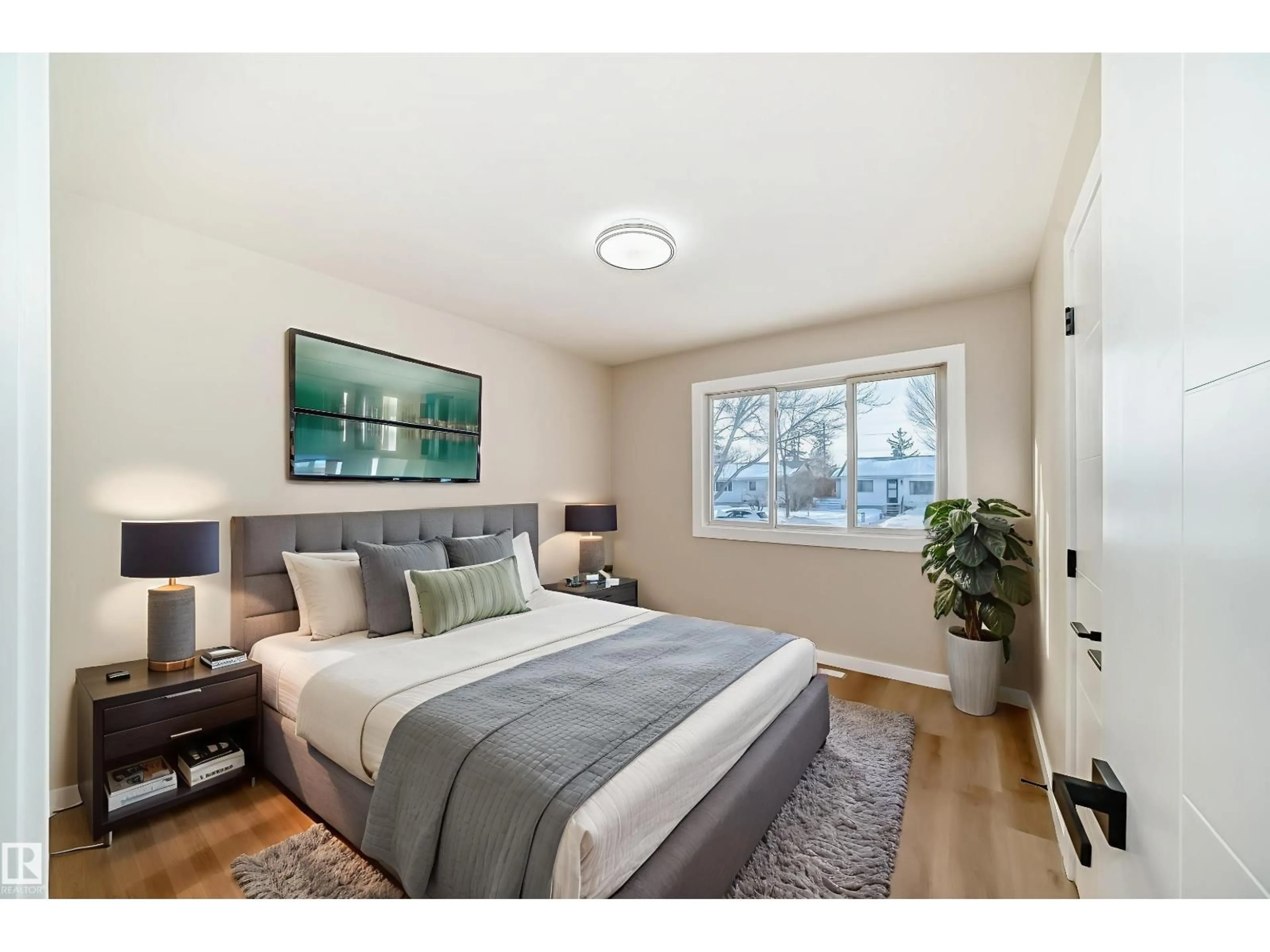 Bedroom with bed, wood/laminate floor for NW - 12423 141 ST, Edmonton Alberta T5L2G4