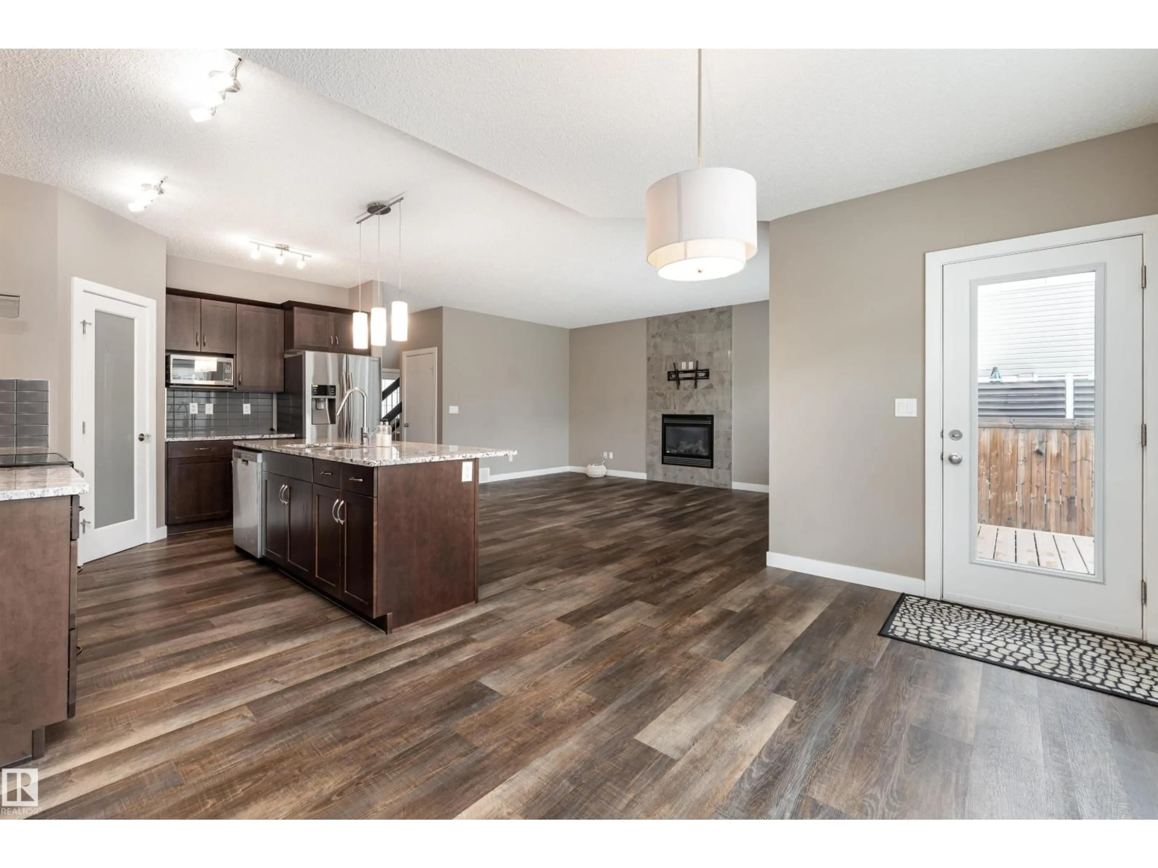 Open concept kitchen, wood/laminate floor for 2211 CALHOUN LI SW, Edmonton Alberta T6W3E1
