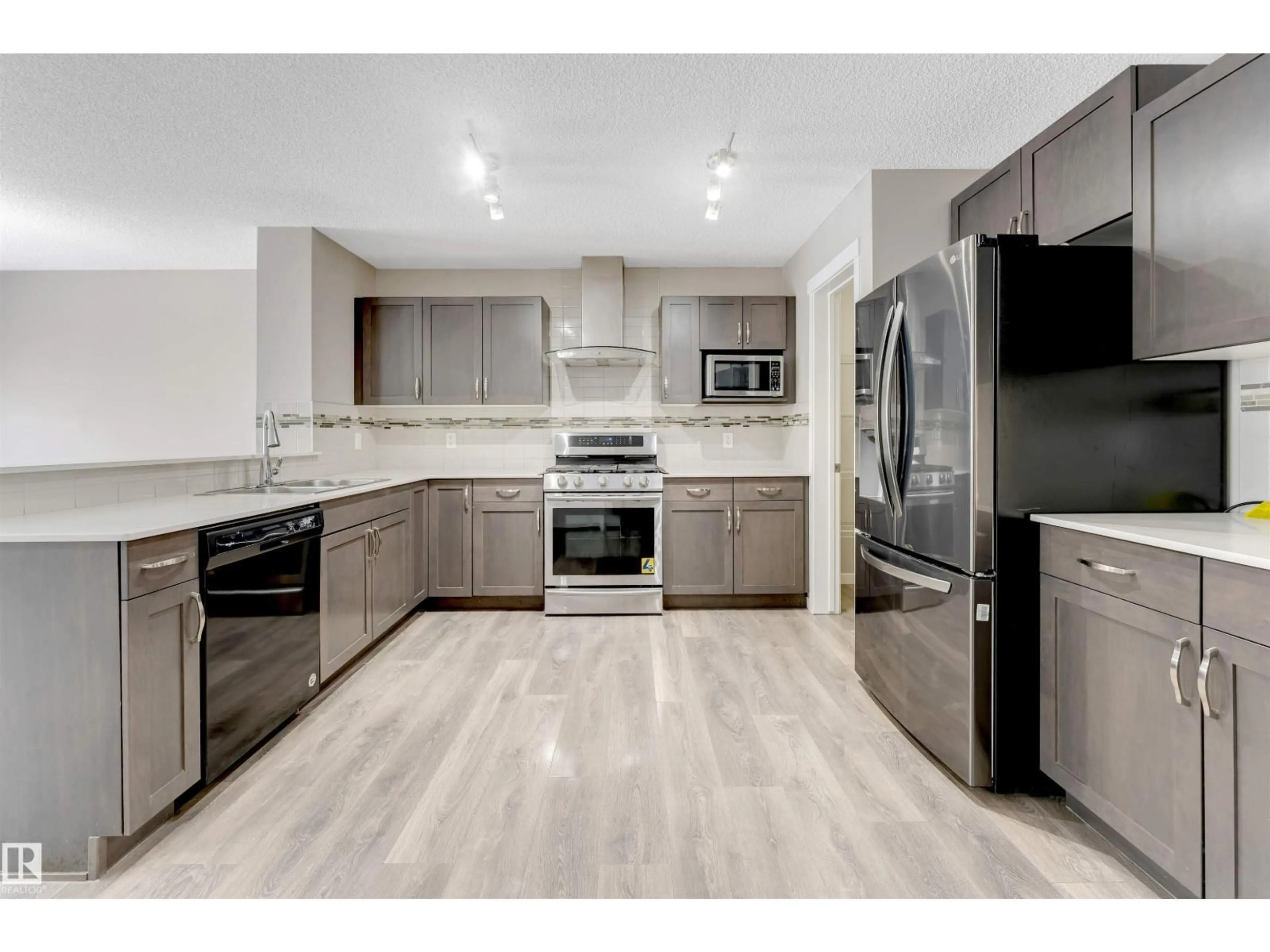 Open concept kitchen, unknown for NW - 1217 29 ST, Edmonton Alberta T6T1A9
