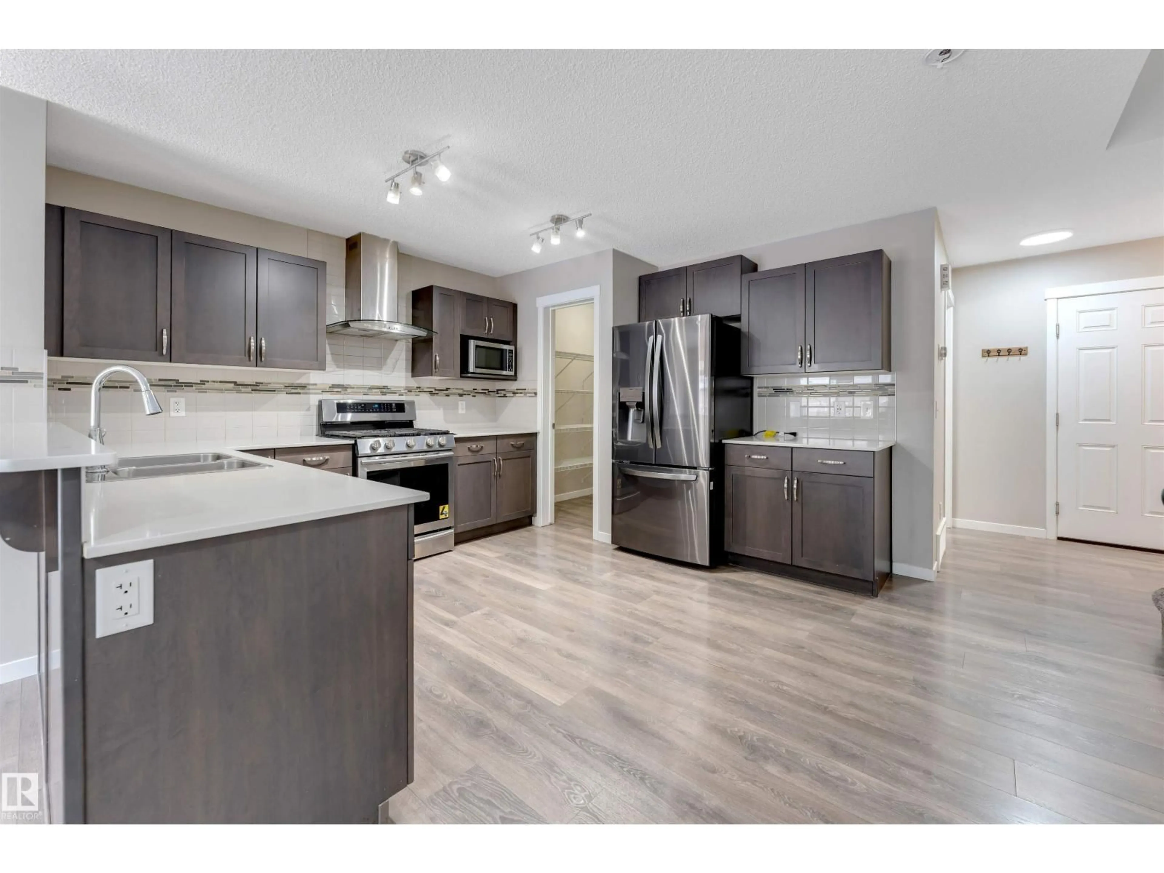 Open concept kitchen, unknown for NW - 1217 29 ST, Edmonton Alberta T6T1A9
