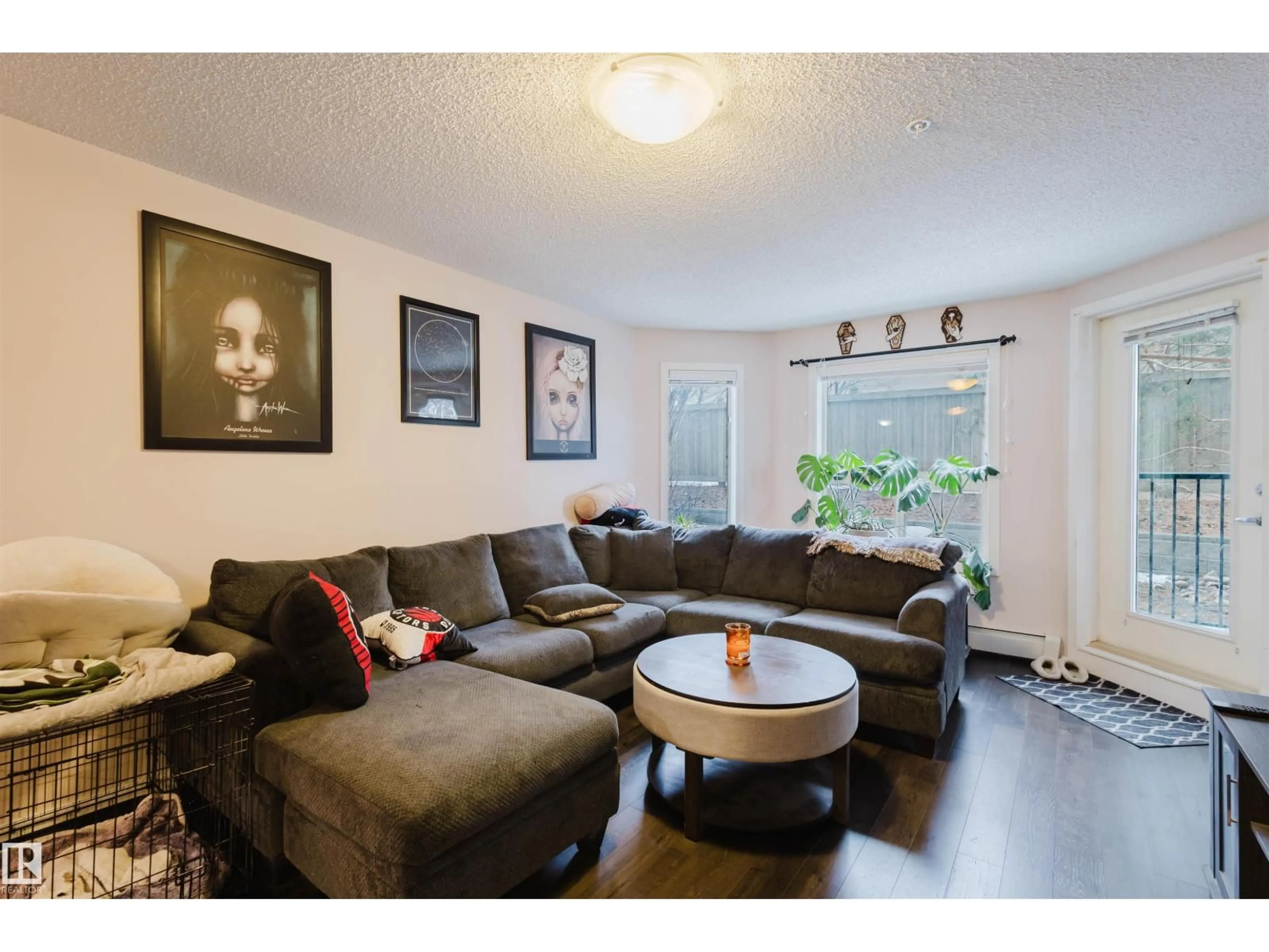 Living room with furniture, wood/laminate floor for 108 - 396 SILVER BERRY RD, Edmonton Alberta T6T0H1