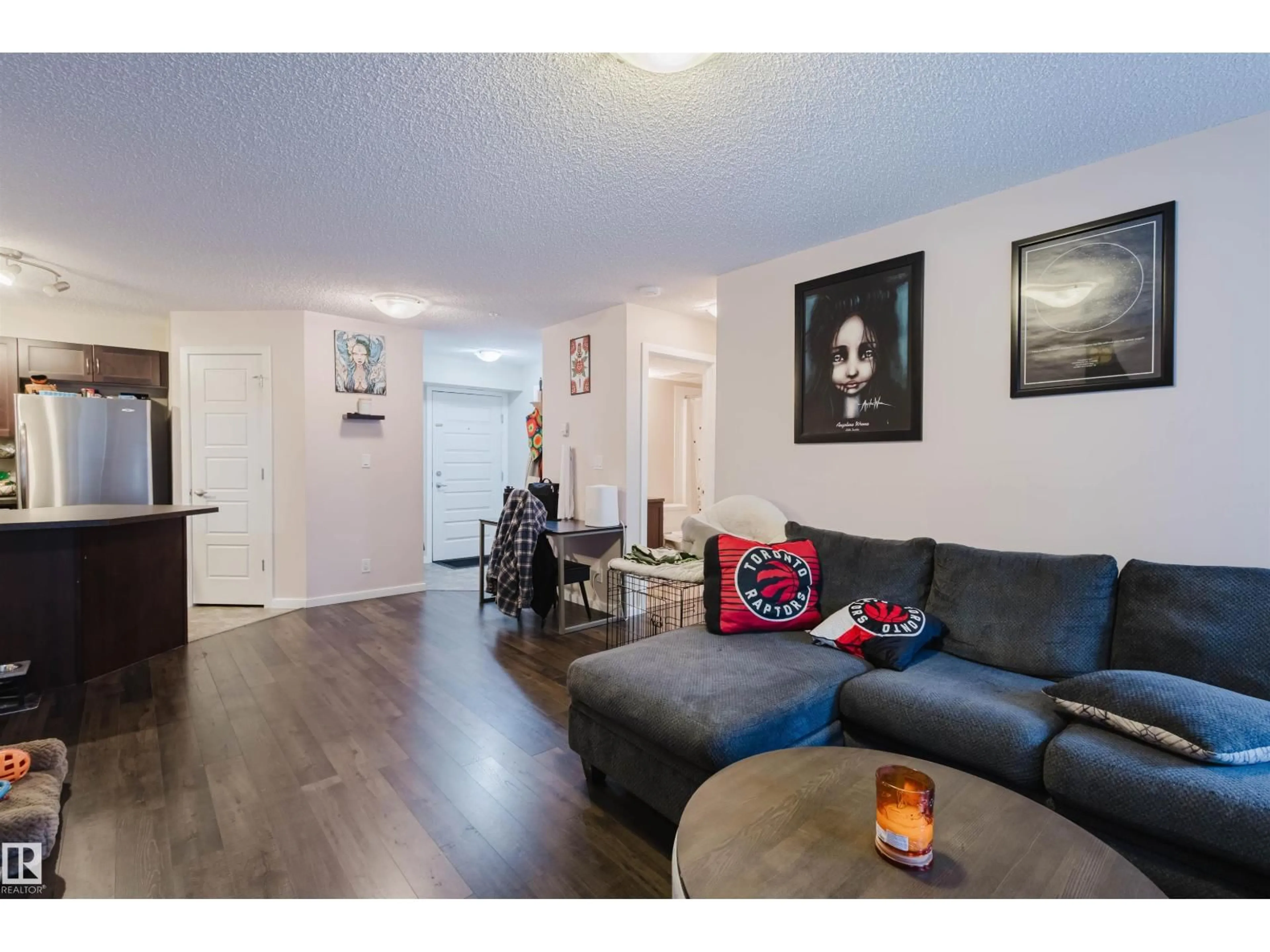 Living room with furniture, wood/laminate floor for 108 - 396 SILVER BERRY RD, Edmonton Alberta T6T0H1