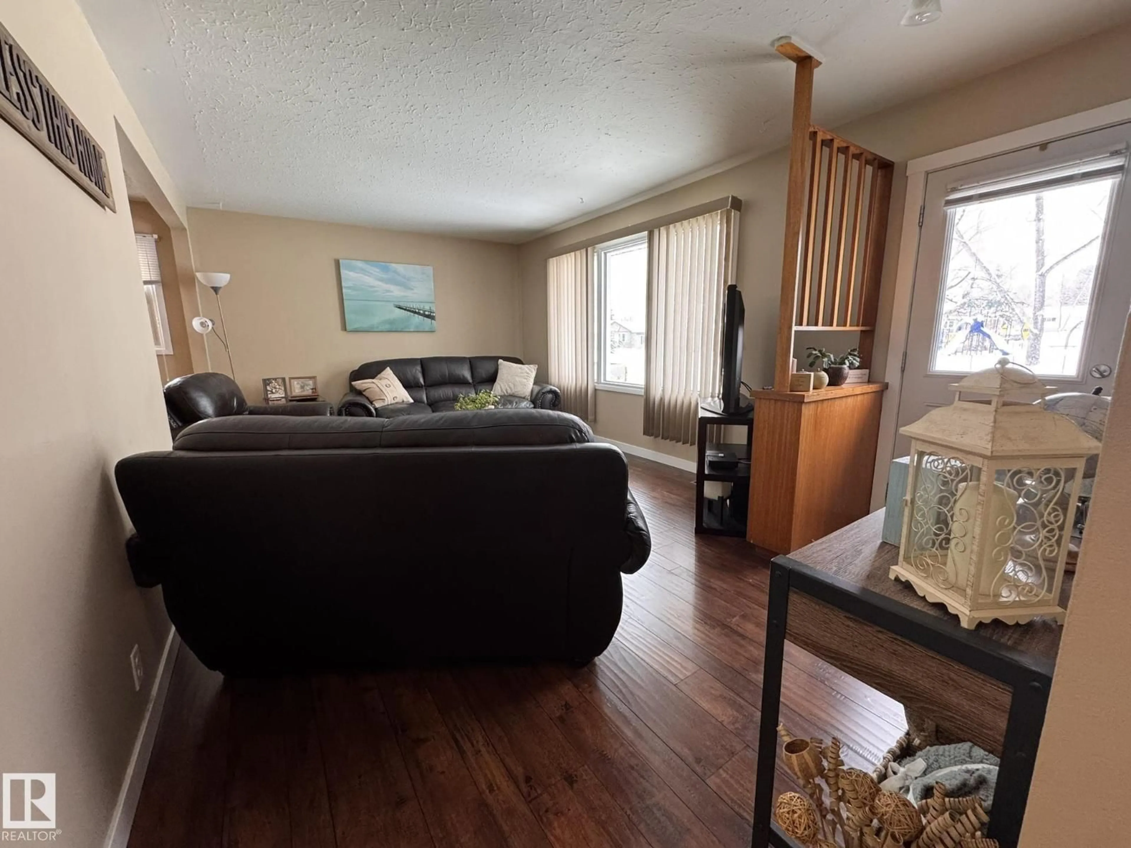 Living room with furniture, wood/laminate floor for 4732 48 AVENUE, Drayton Valley Alberta T7A1H9
