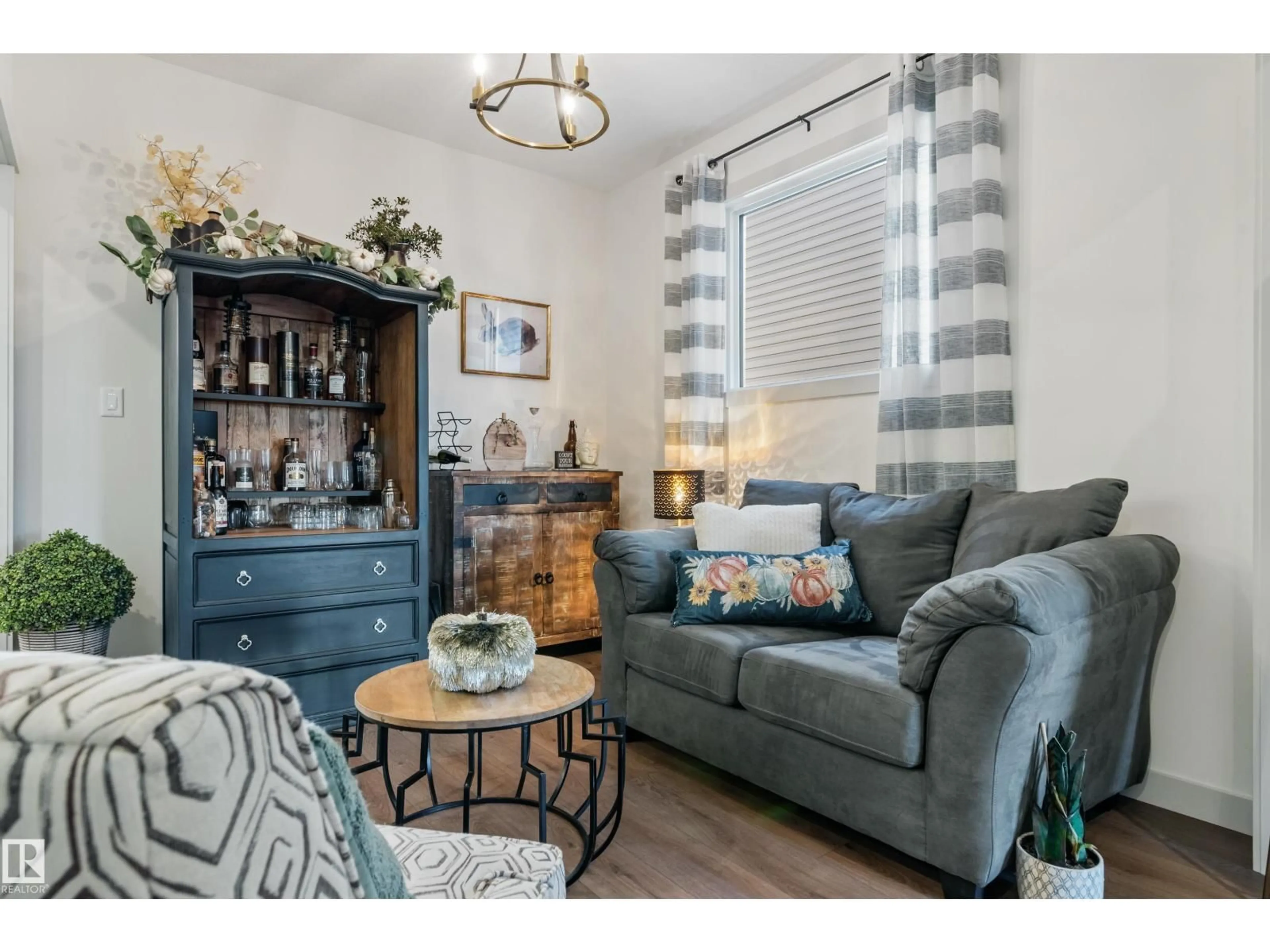 Living room with furniture, wood/laminate floor for 57 SAVOY CR, Sherwood Park Alberta T8H2Y3