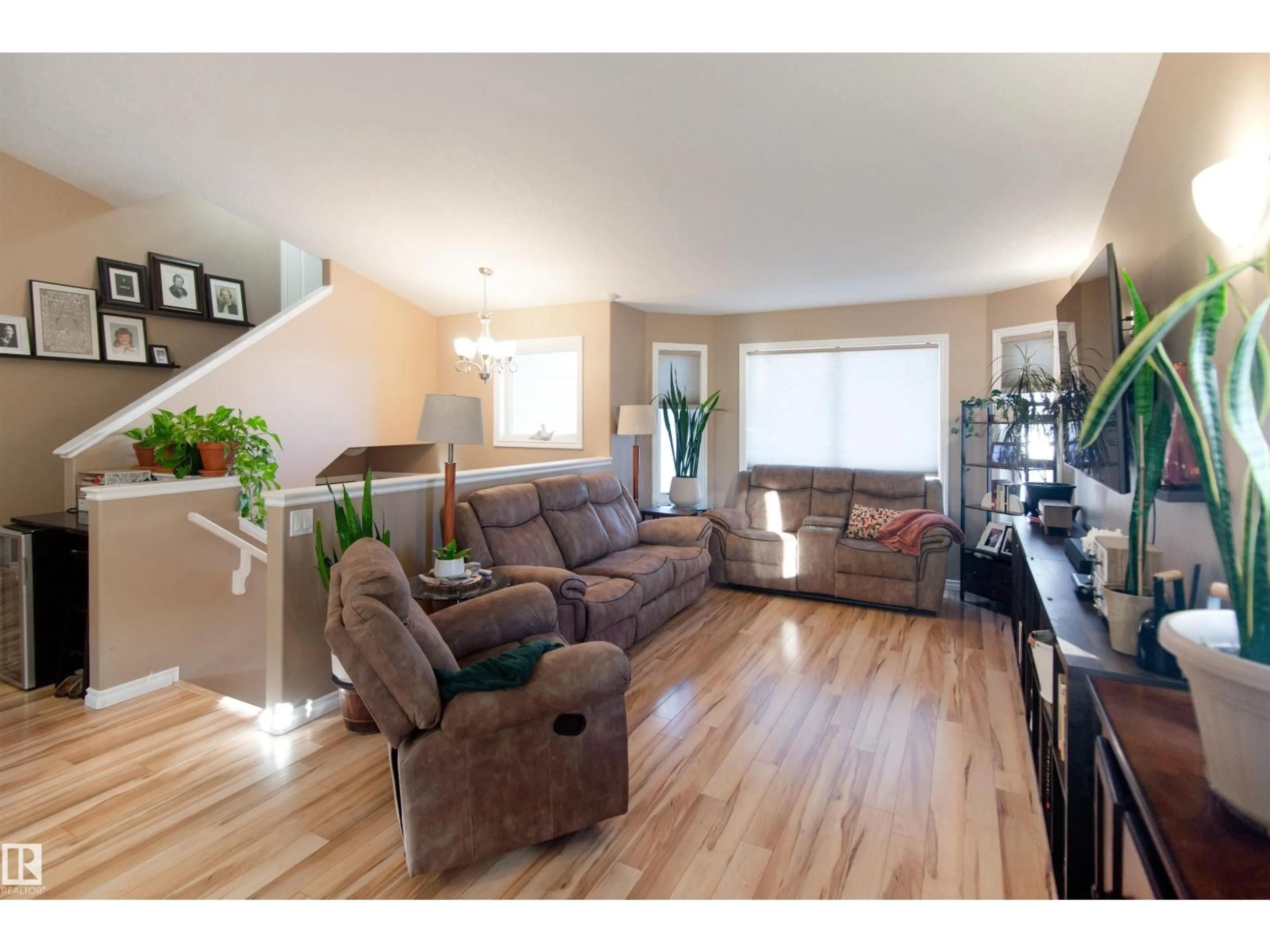 Living room with furniture, wood/laminate floor for 3706 45 AV, Bonnyville Town Alberta T9N0A8