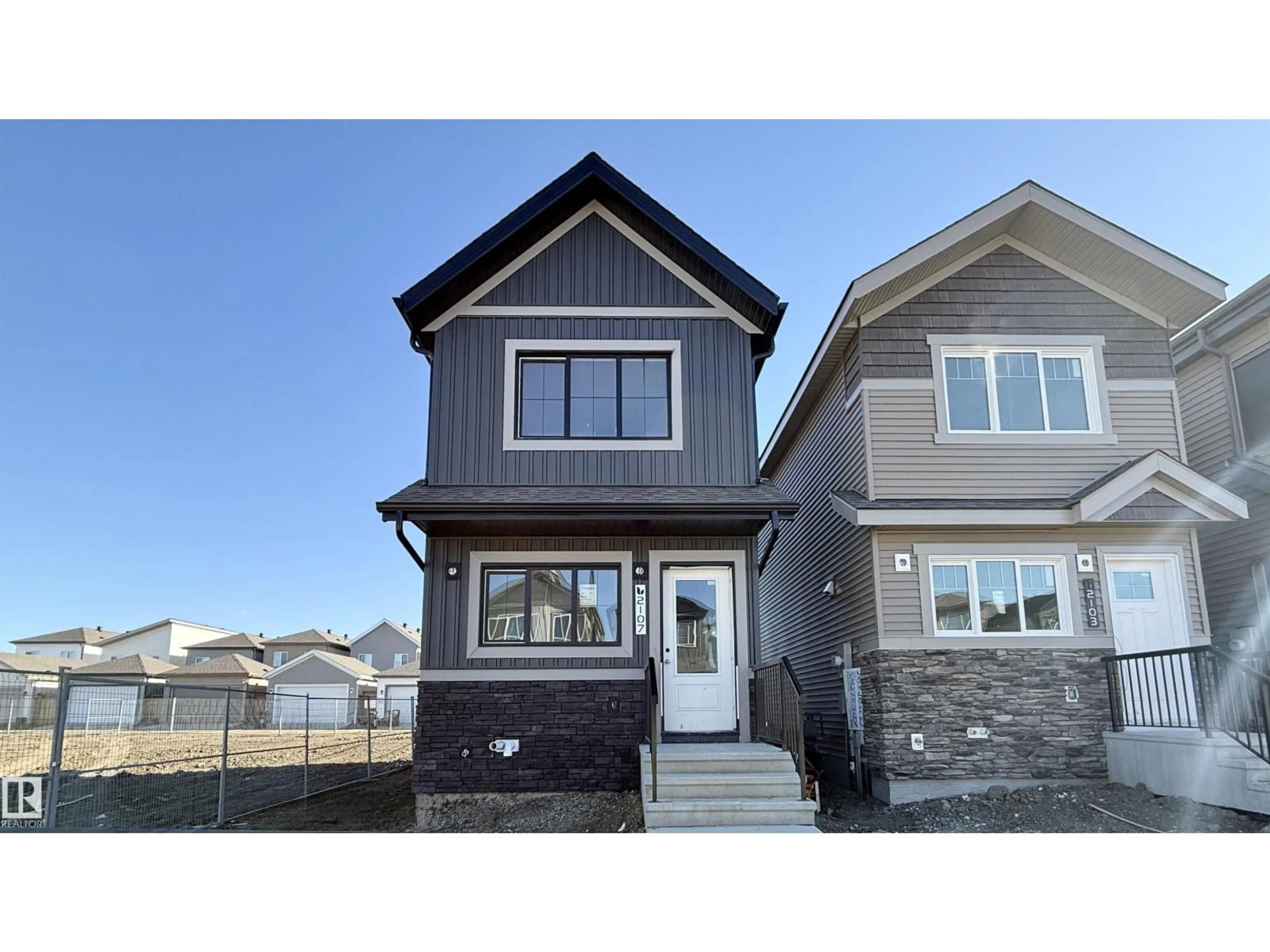 Home with vinyl exterior material, street for NW - 2119 210 ST, Edmonton Alberta T5S0T1