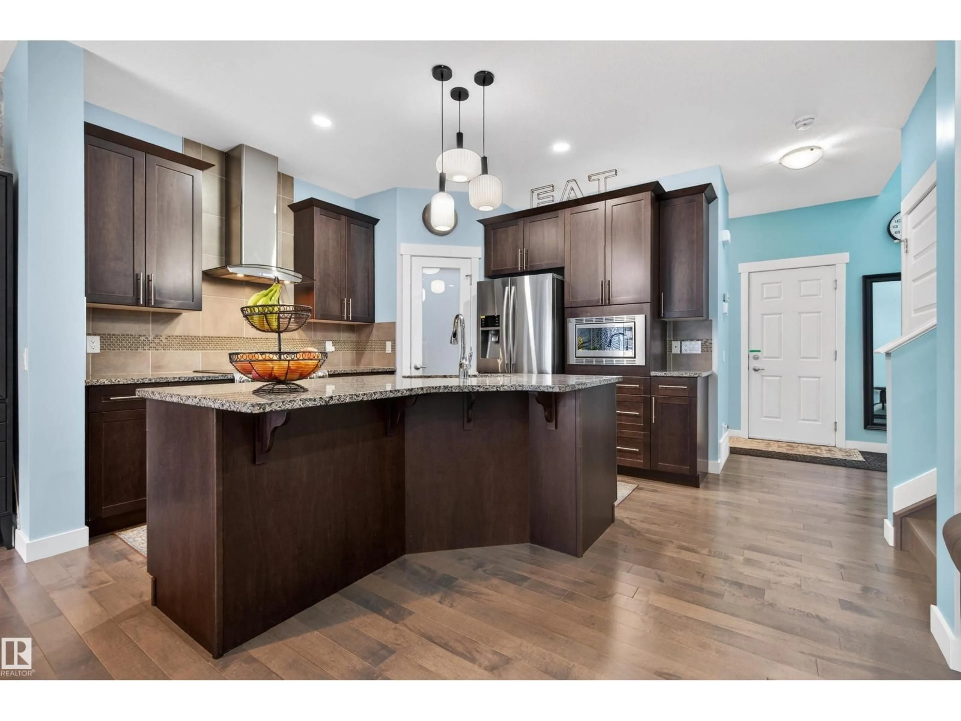 Open concept kitchen, wood/laminate floor for 21615 84 AV, Edmonton Alberta T5T4W2