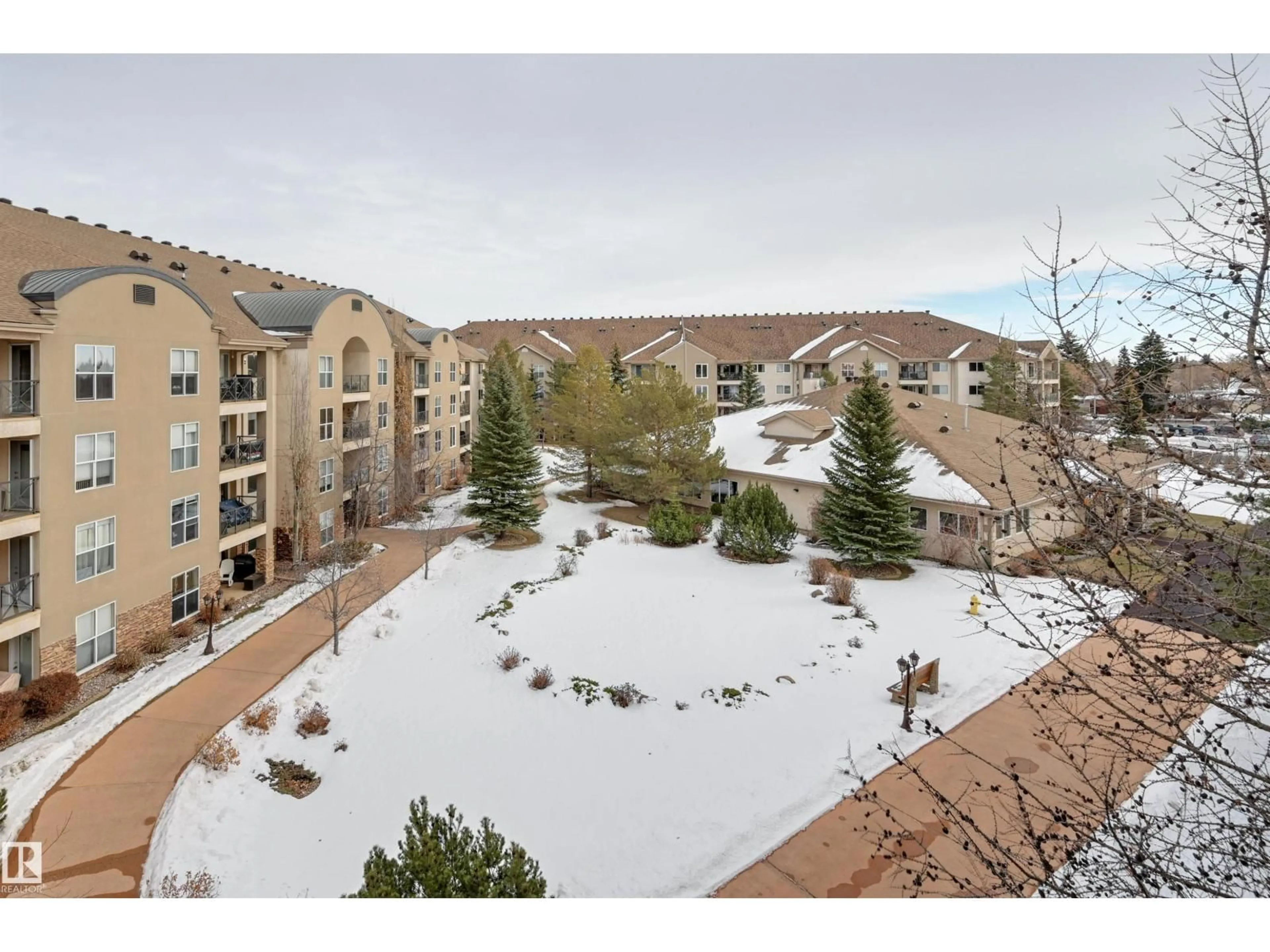 A pic from outside/outdoor area/front of a property/back of a property/a pic from drone, mountain view for #208 - 8912 156 ST, Edmonton Alberta T5R5Z2