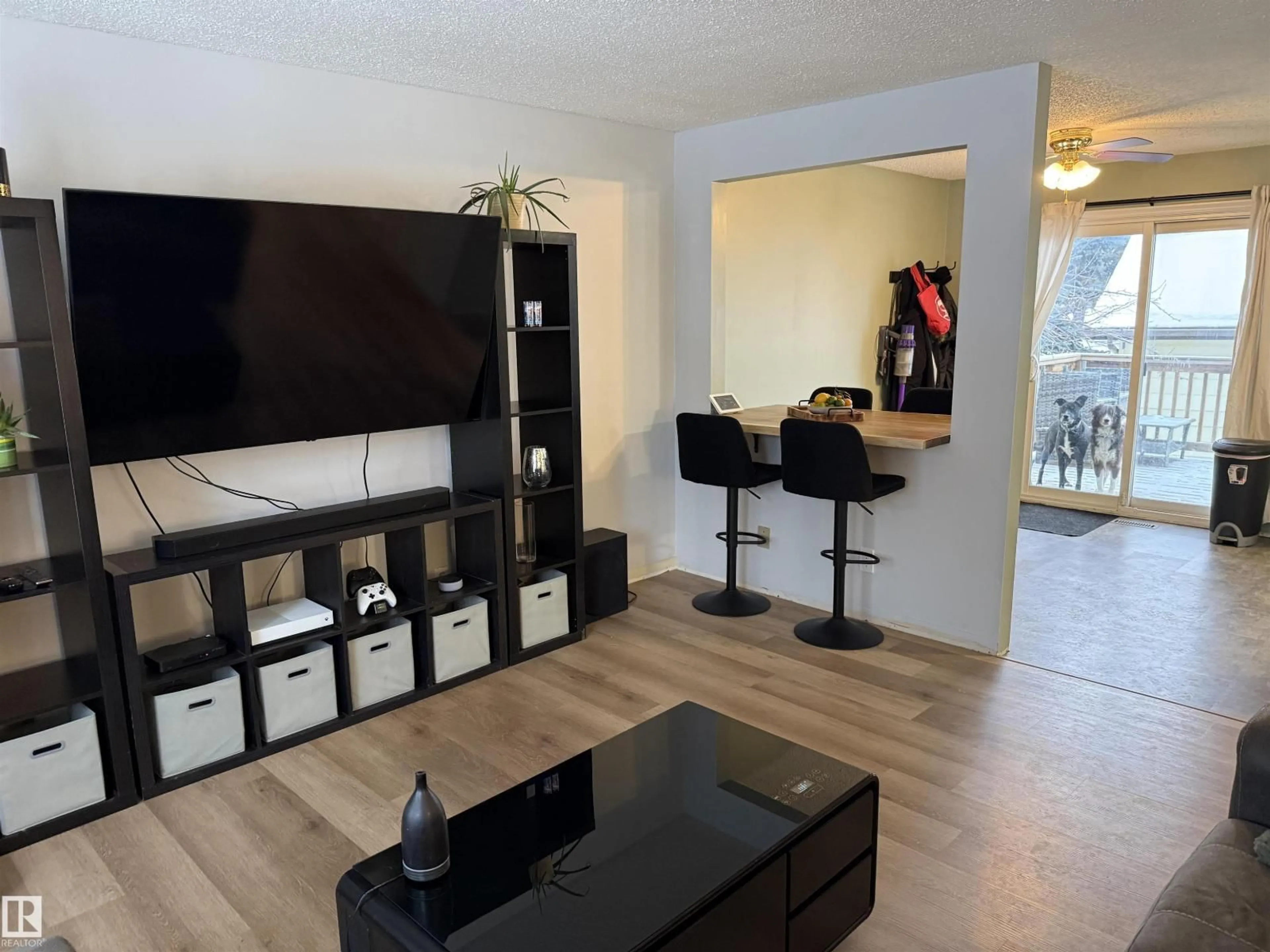 Living room with furniture, wood/laminate floor for 17115 100 ST, Edmonton Alberta T5X3G7