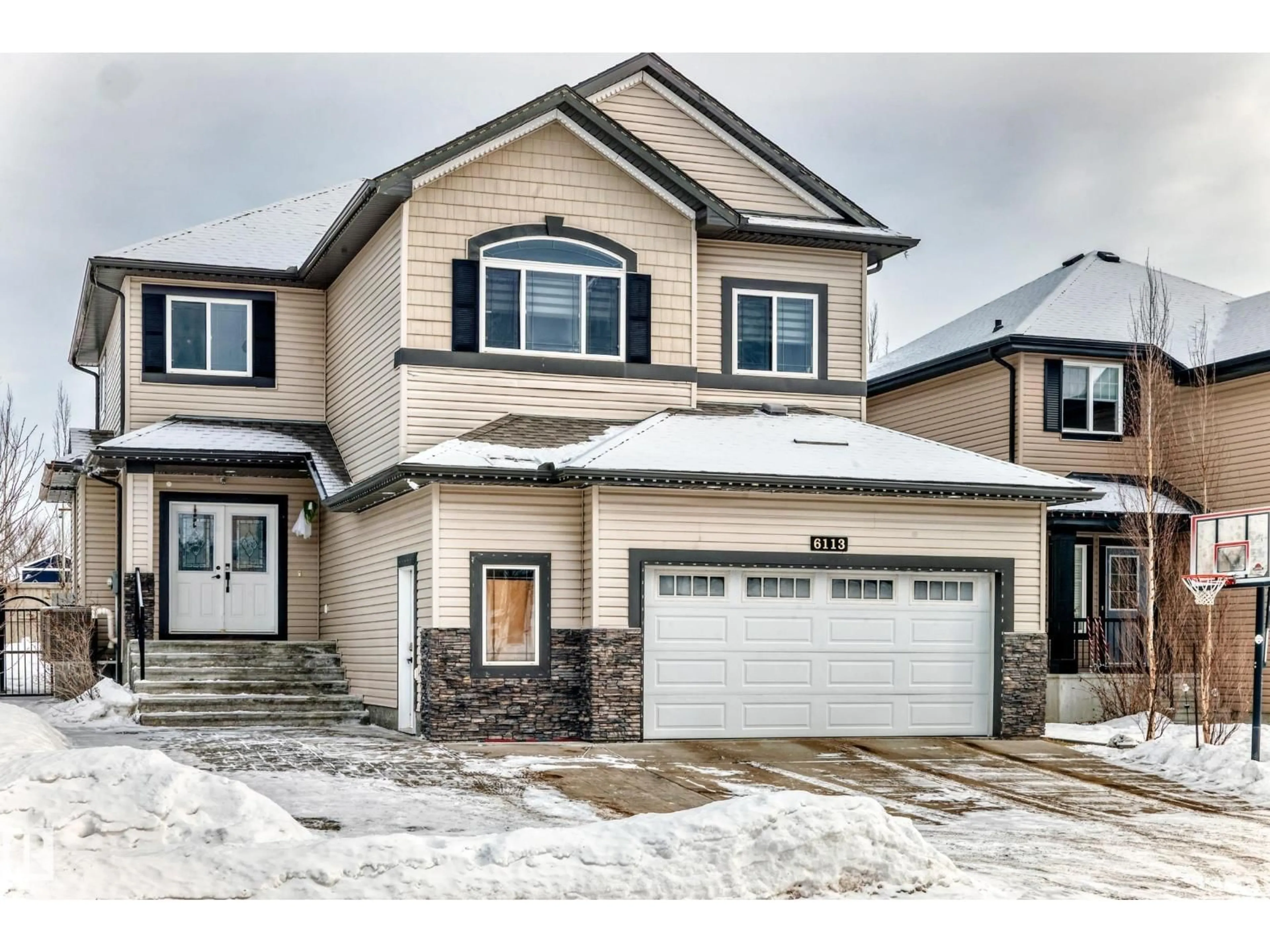 Home with vinyl exterior material, street for 6113 60 ST, Beaumont Alberta T4X0H8