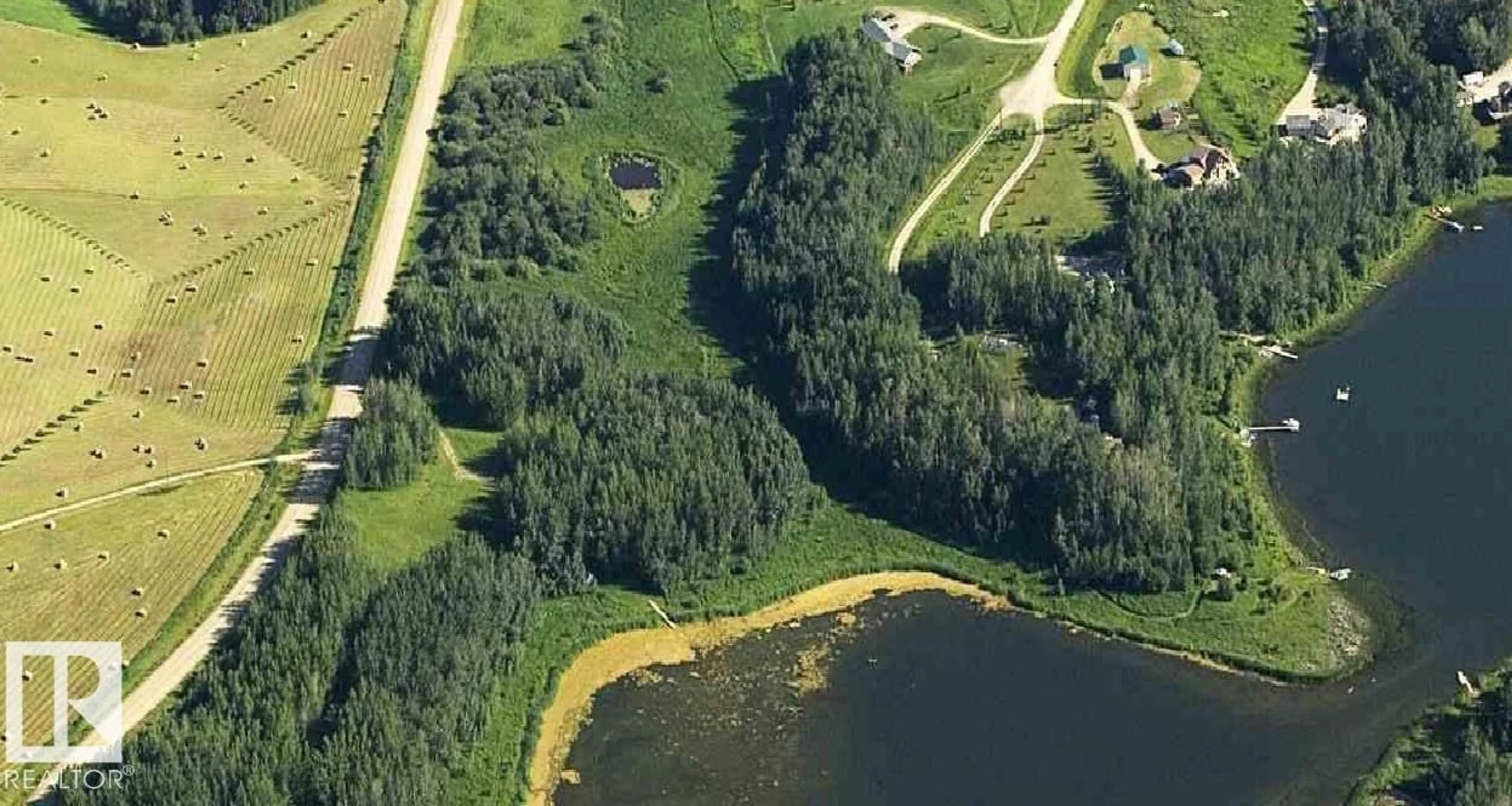 A pic from outside/outdoor area/front of a property/back of a property/a pic from drone, water/lake/river/ocean view for 52123 RGE ROAD 25, Rural Parkland County Alberta T0E0H0