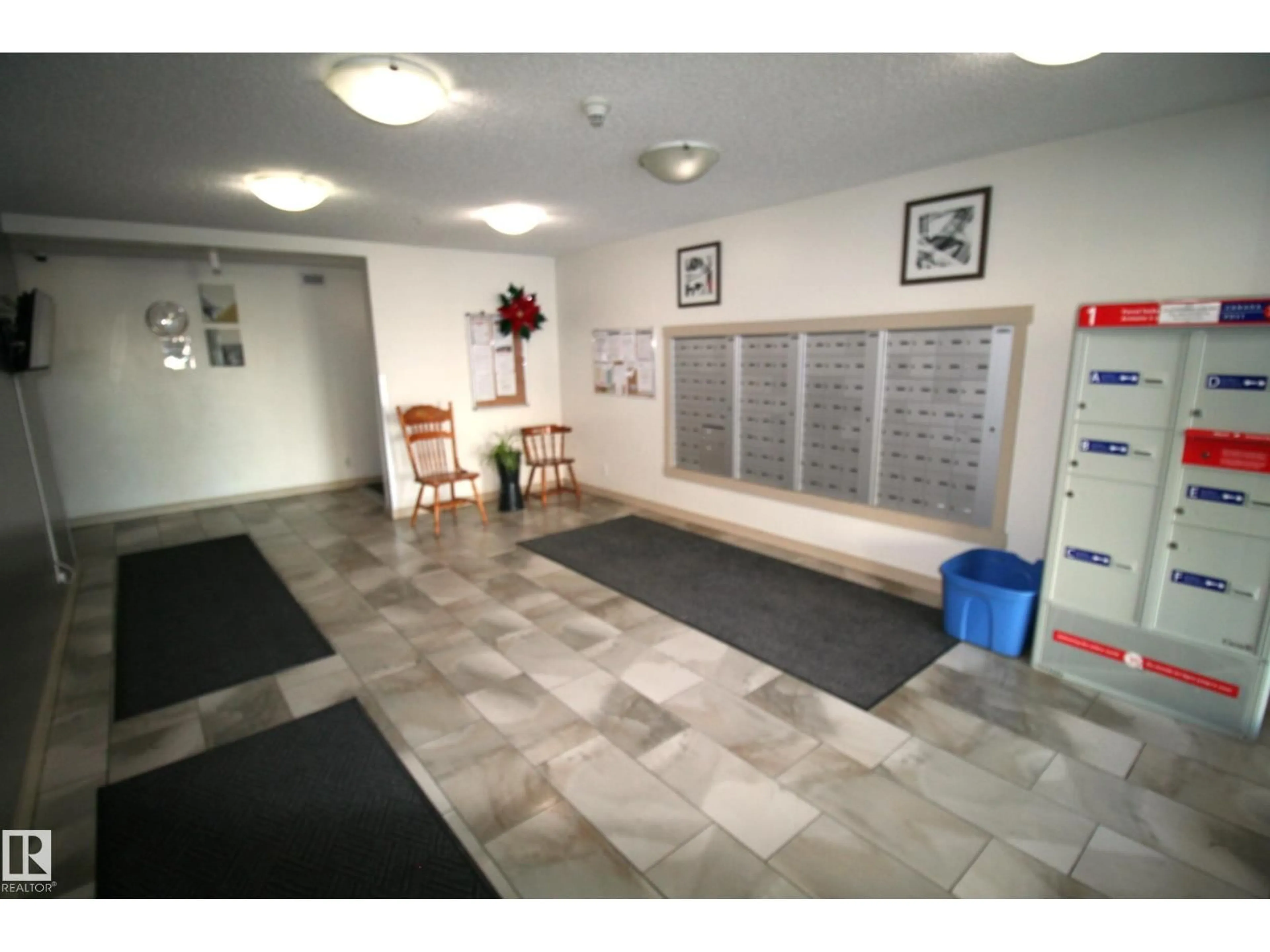 Indoor foyer for #419 - 5816 MULLEN PL, Edmonton Alberta T6R0J3