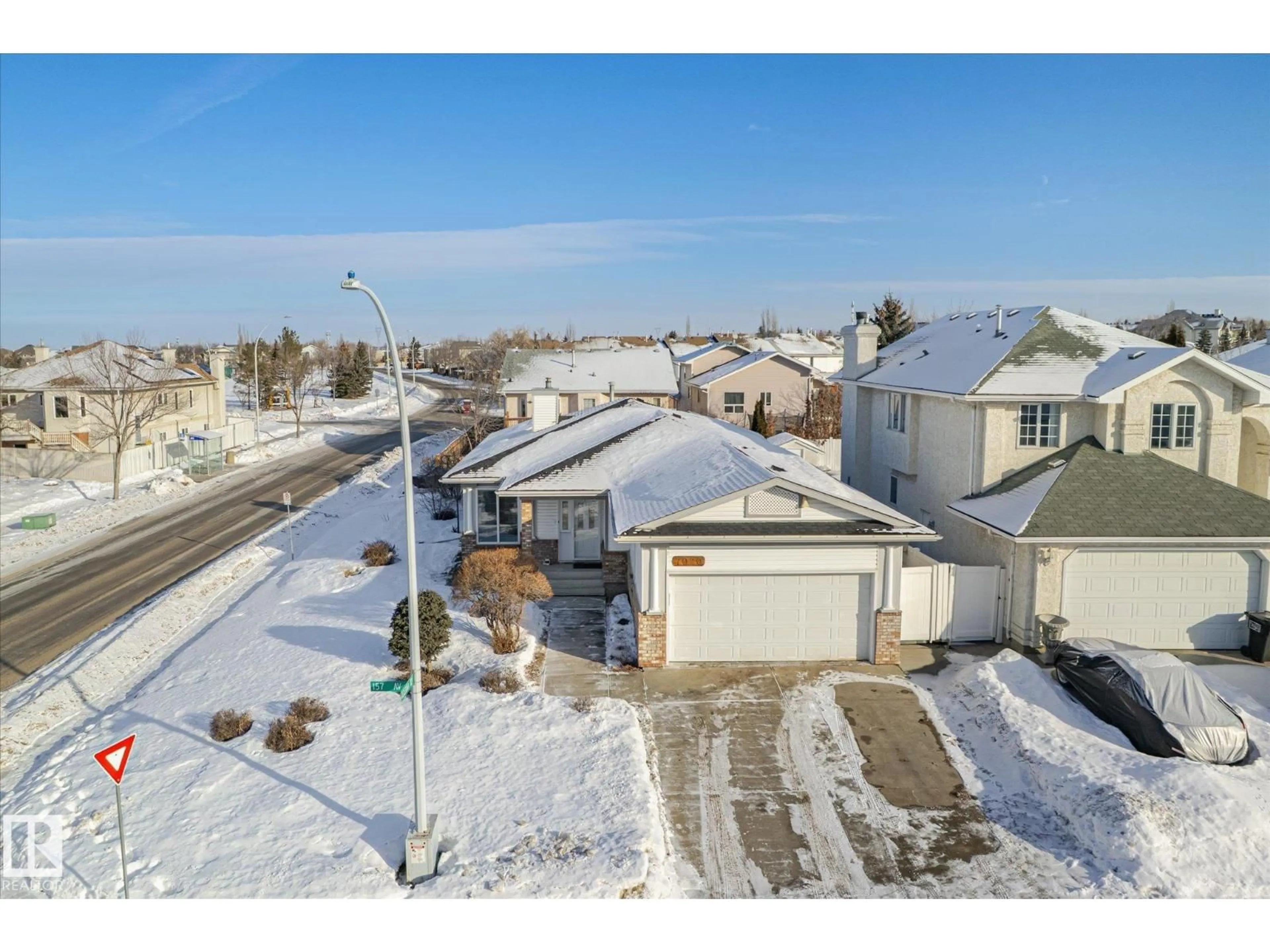 A pic from outside/outdoor area/front of a property/back of a property/a pic from drone, street for 7020 157 AV, Edmonton Alberta T5Z2Z4