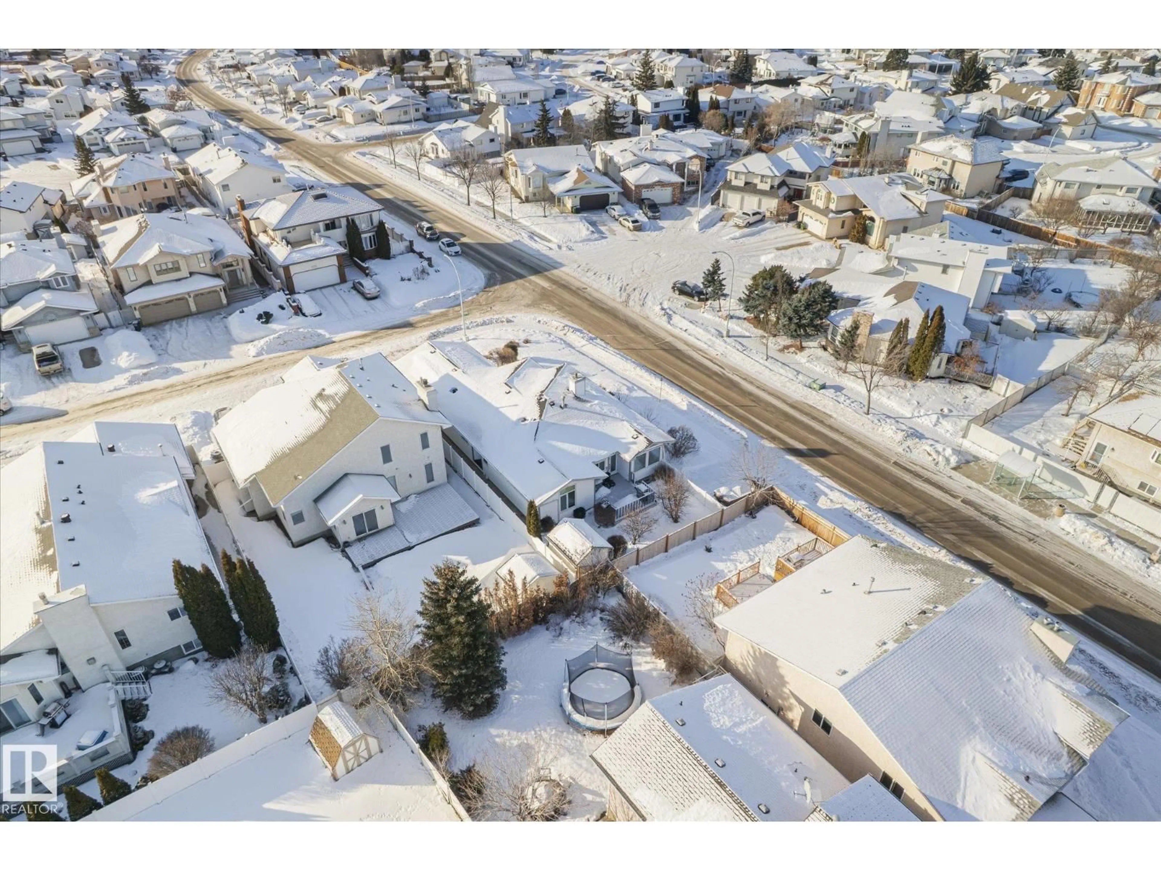 A pic from outside/outdoor area/front of a property/back of a property/a pic from drone, street for 7020 157 AV, Edmonton Alberta T5Z2Z4